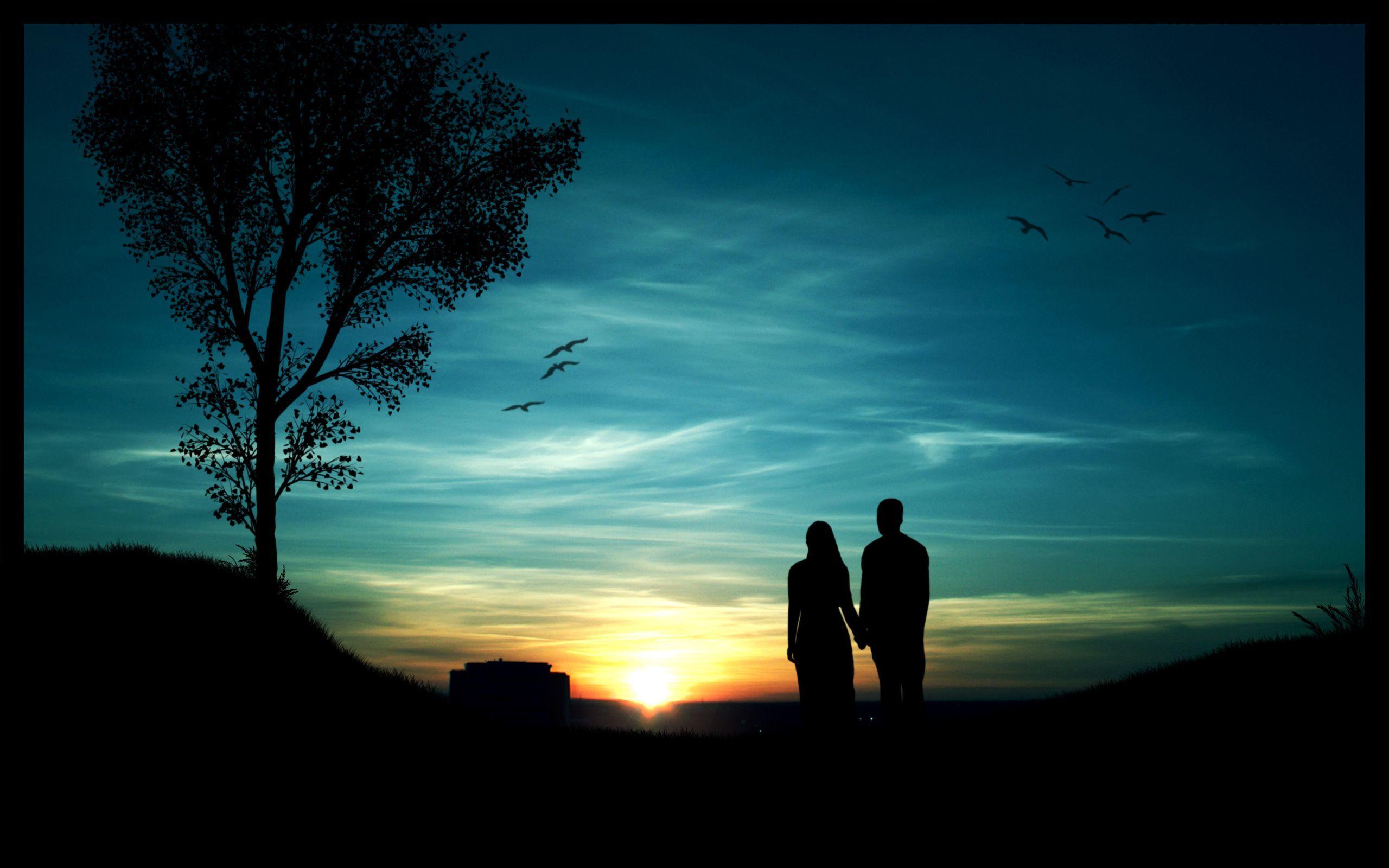 Couple's silhouette in the sunset Wallpaper