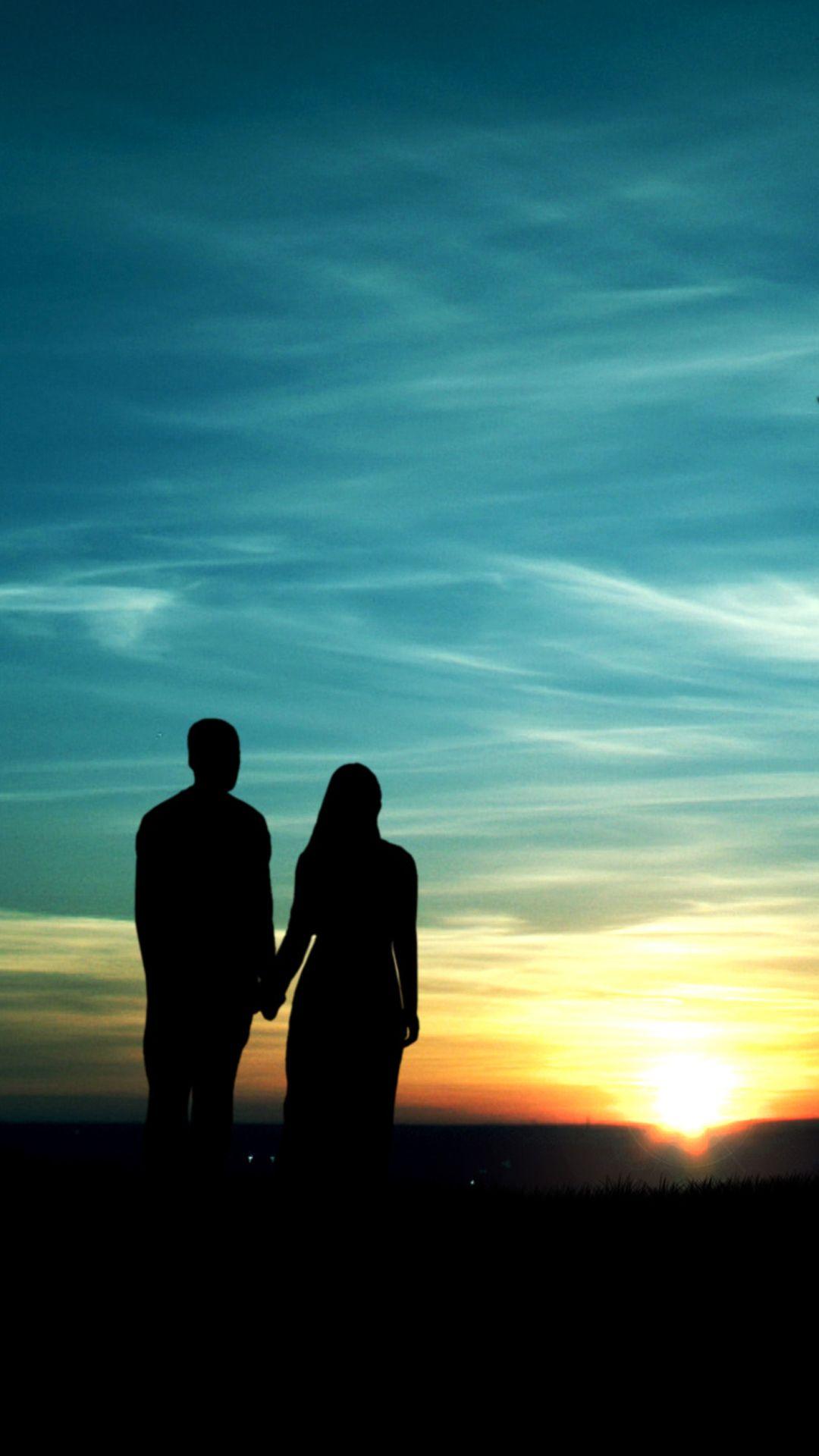 Couple silhouette in the sunset Mobile Wallpaper. Foto di coppia