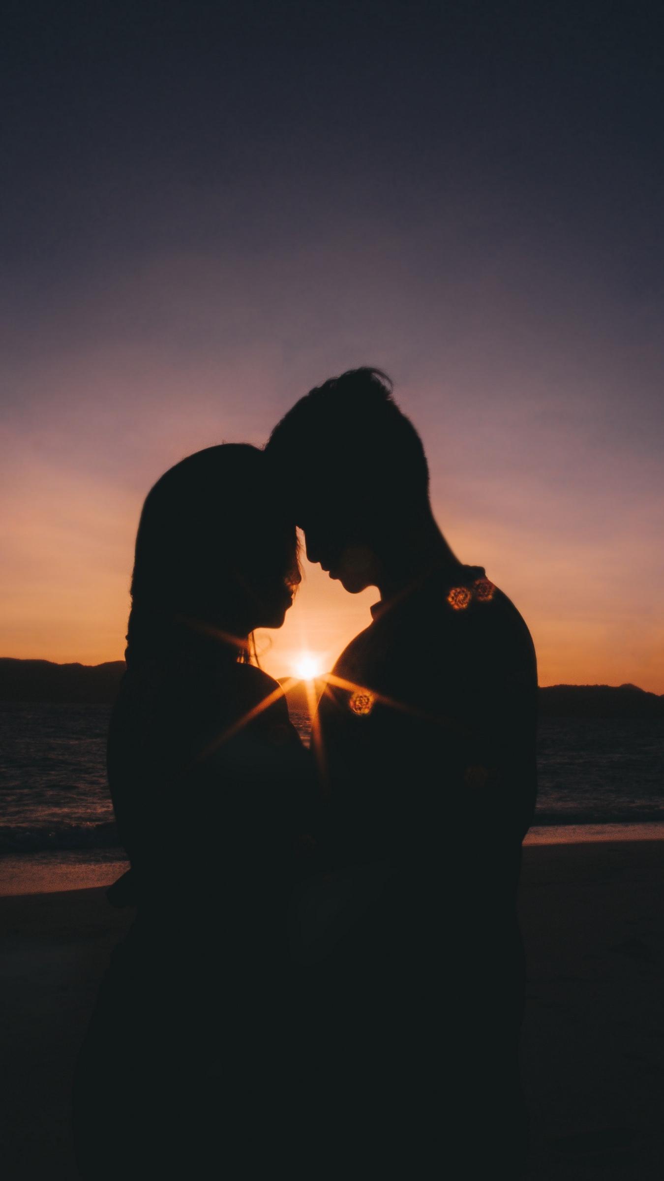 kissing couple silhouette sunset