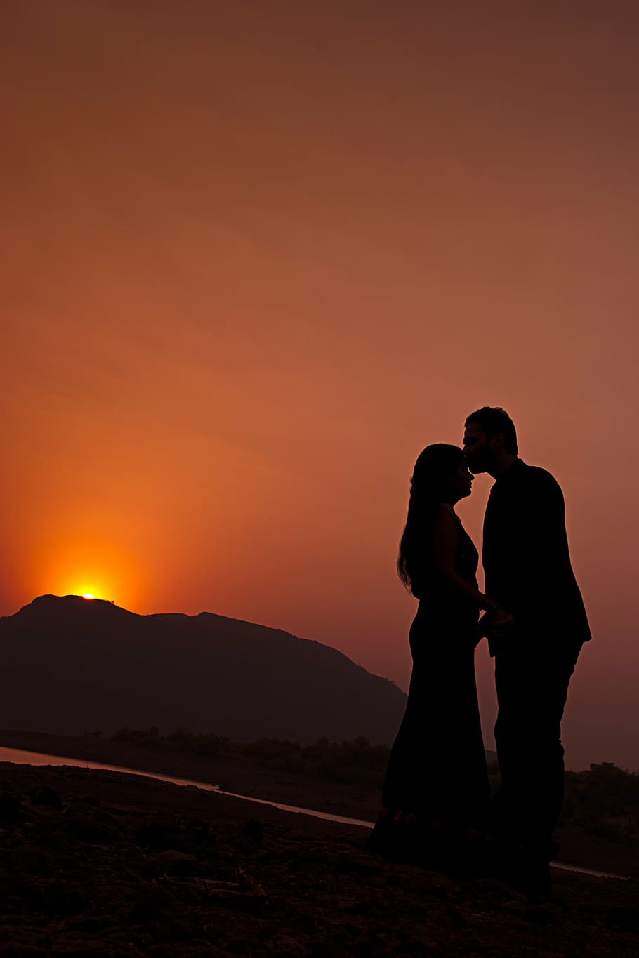 HD wallpaper: silhouette of man kissing forehead of woman during