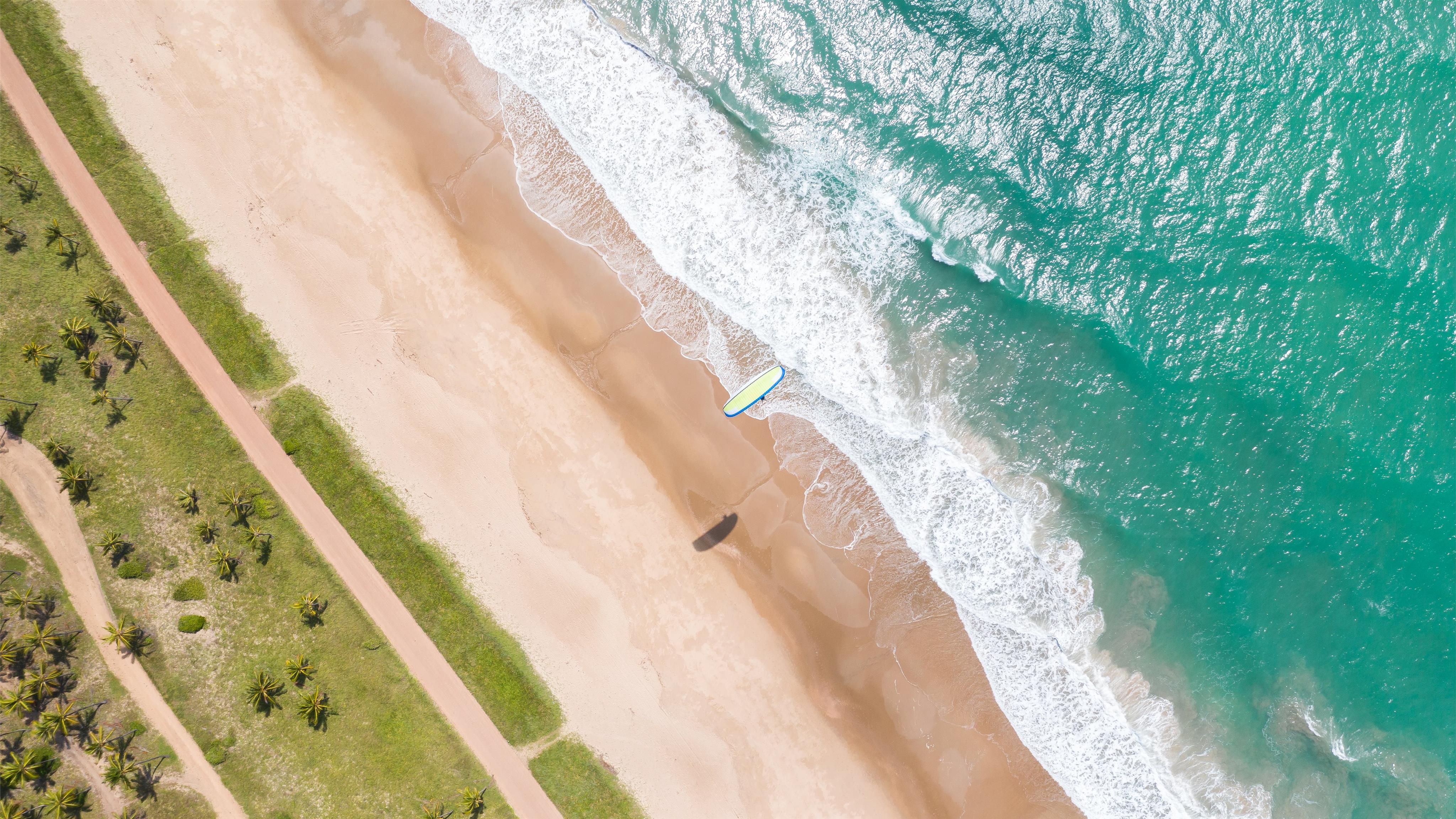 aerial view of seashore at daytime Mac Wallpaper Download