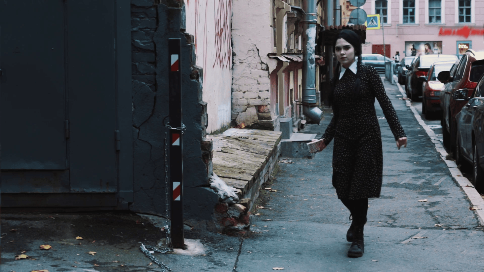 Cosplayer Girl In Costume Of Wednesday From Addams