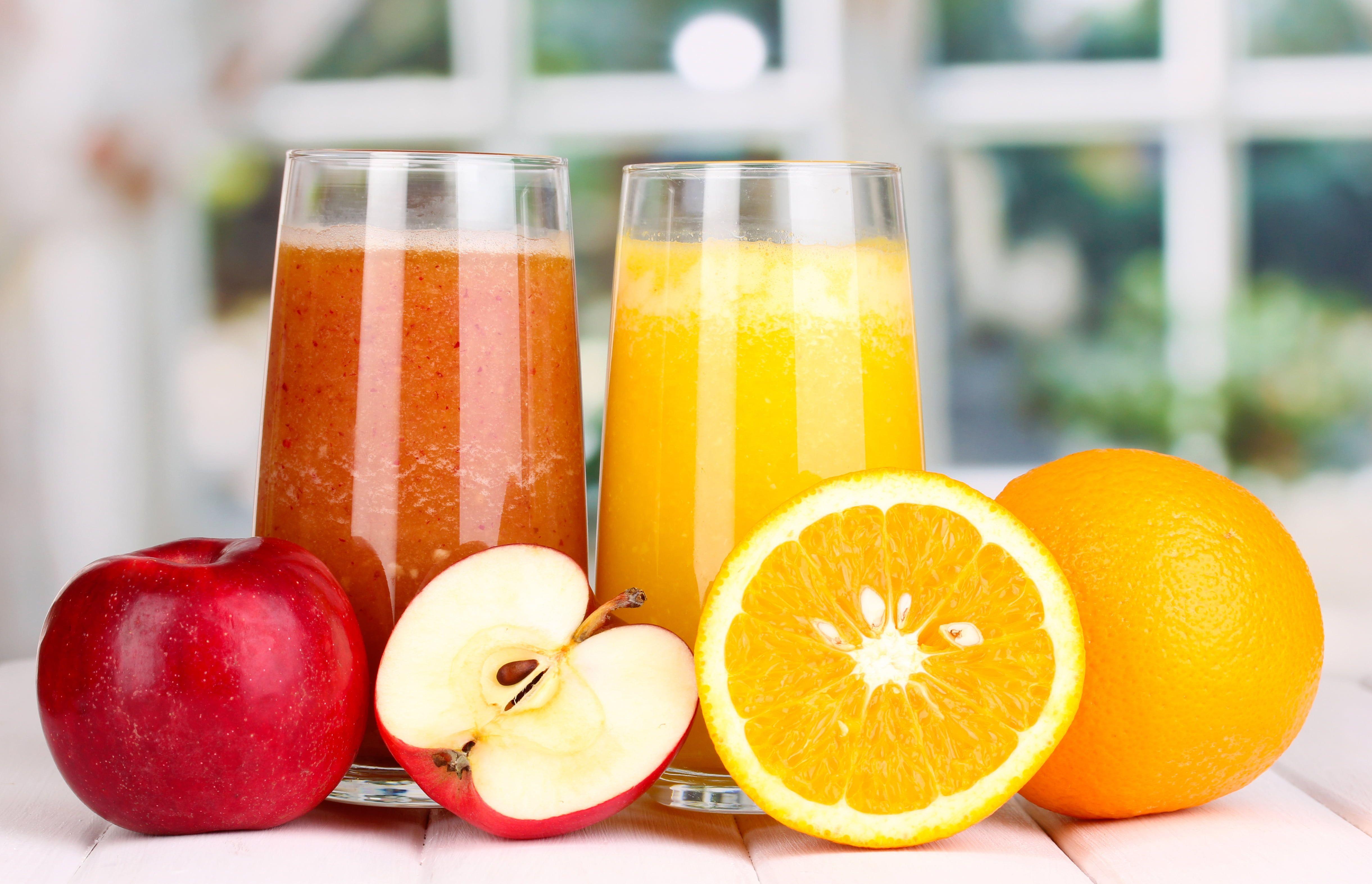 Two orange and apple juices HD wallpaper
