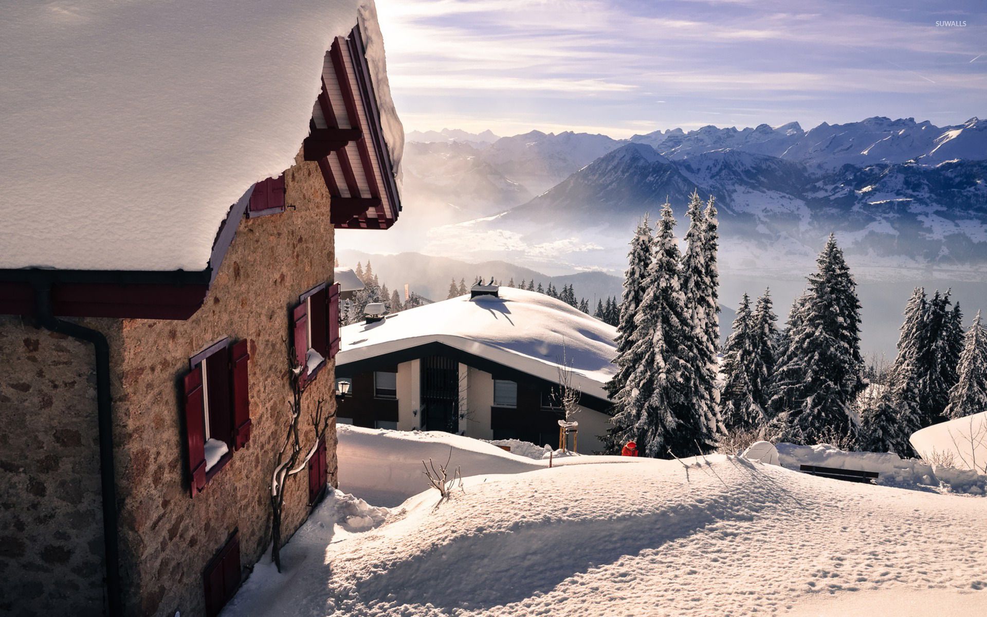 Holiday houses on a snowy mountain top wallpaper