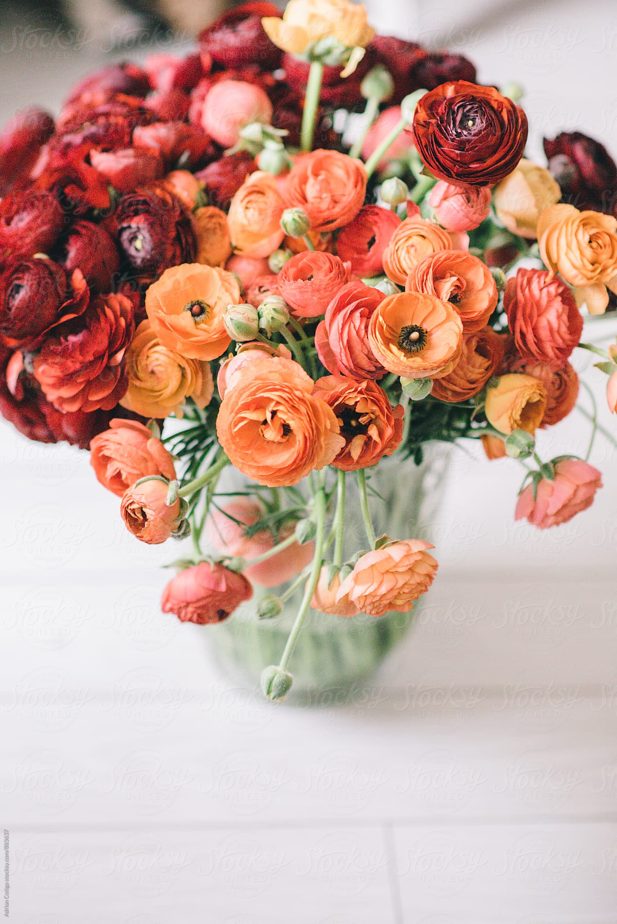 Spring flowers bouquet with orange and red ranunculus