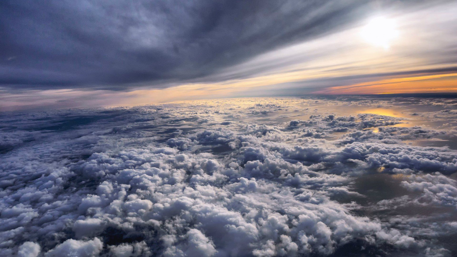 Flying above the clouds at sunset wallpaper and image
