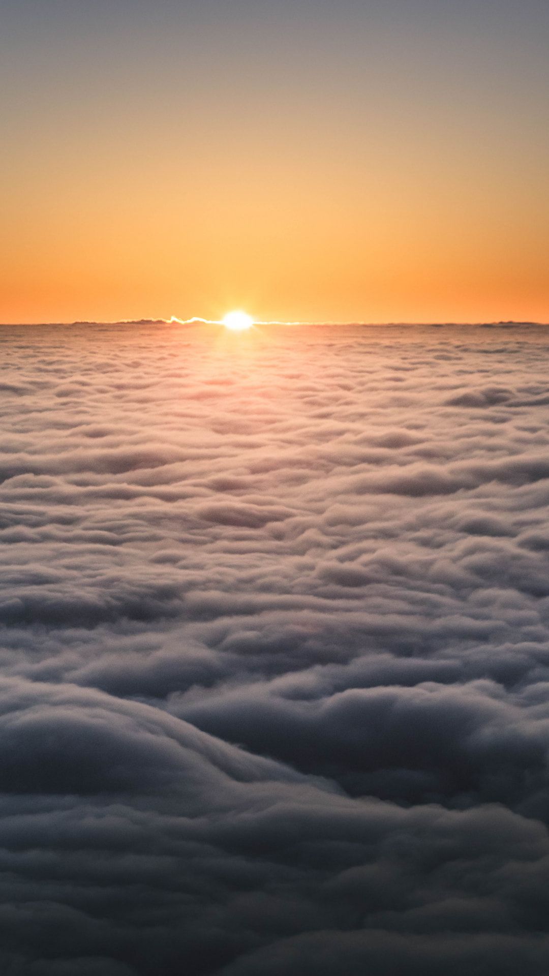 sunset above clouds
