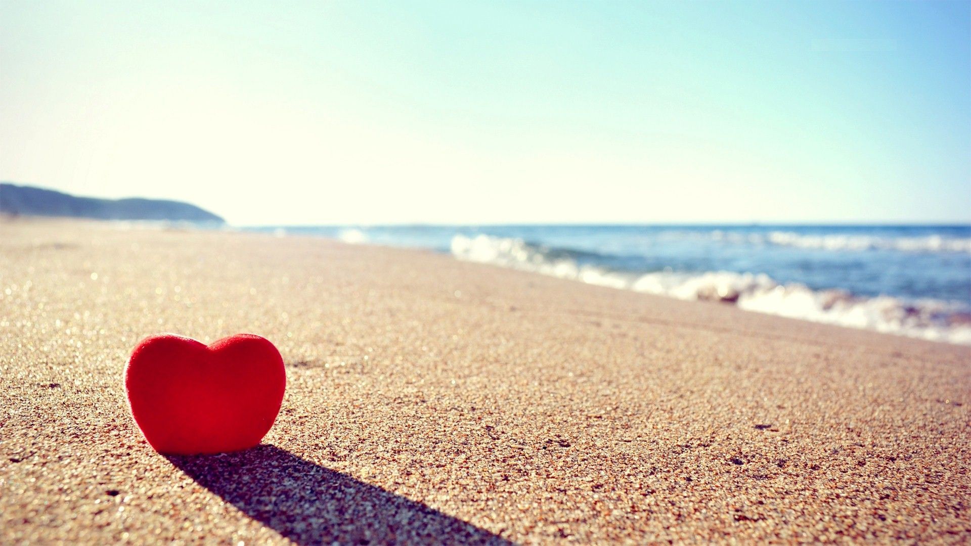 Love heart on beach photo background. Cute love