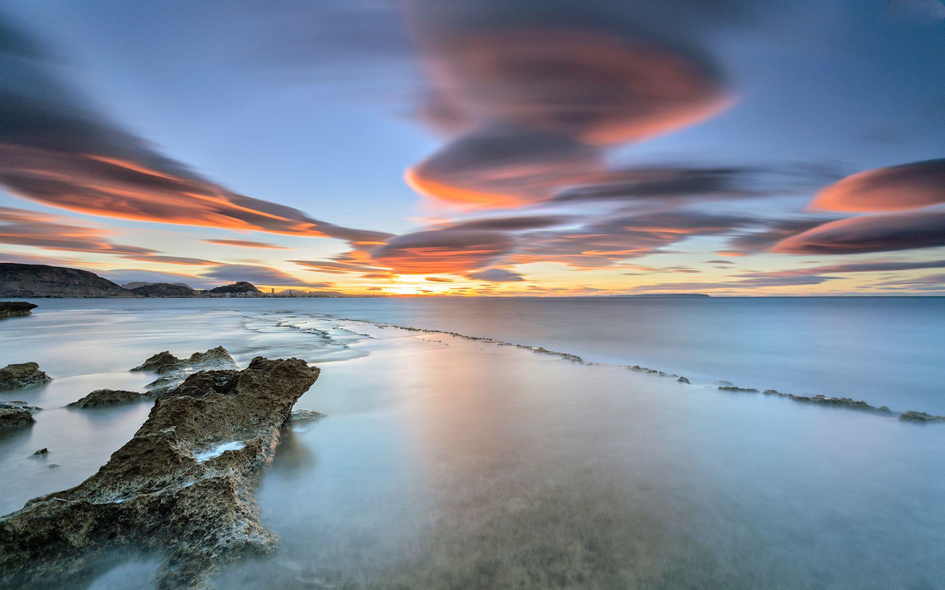 Colorful clouds over the ocean wallpaper