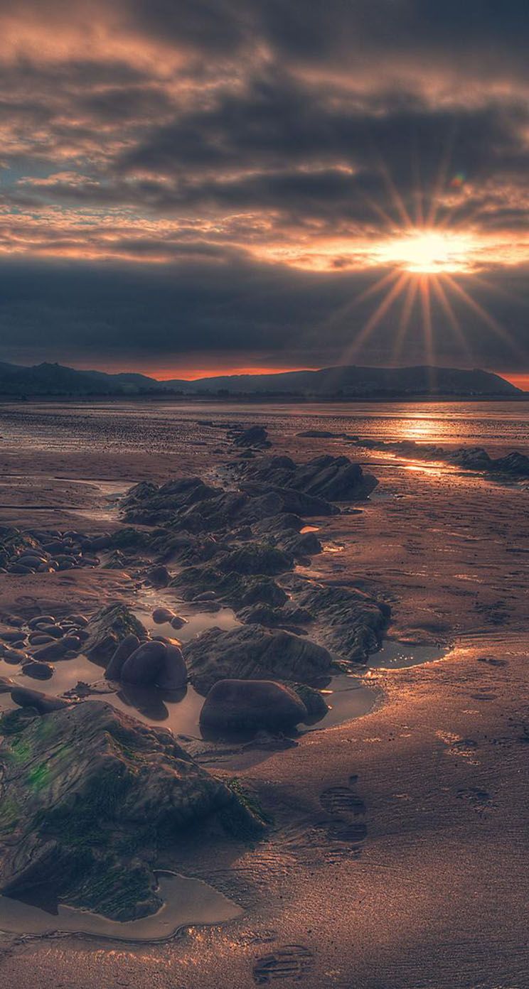 The iPhone Wallpaper Magnificent Sunset on a Rocky Beach