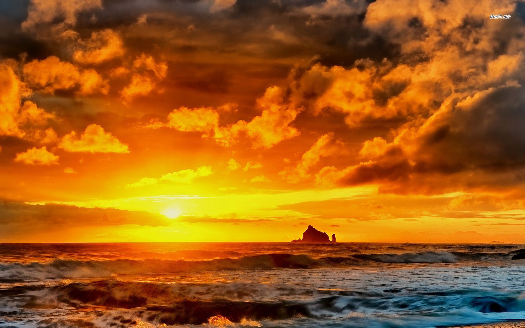 Beautiful golden clouds at sunset above the rocky island wallpaper
