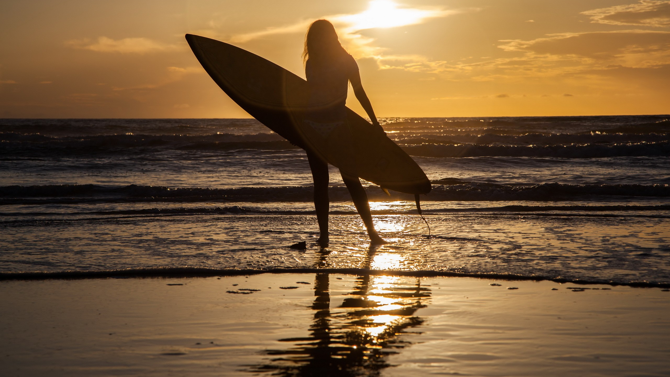 Download 2560x1440 sea, surfing, sun, women, silhouette, beach