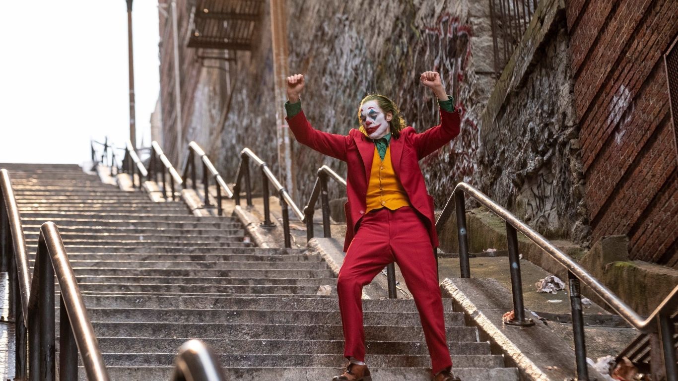 Joaquin Phoenix As Joker Dancing 1366x768 Resolution
