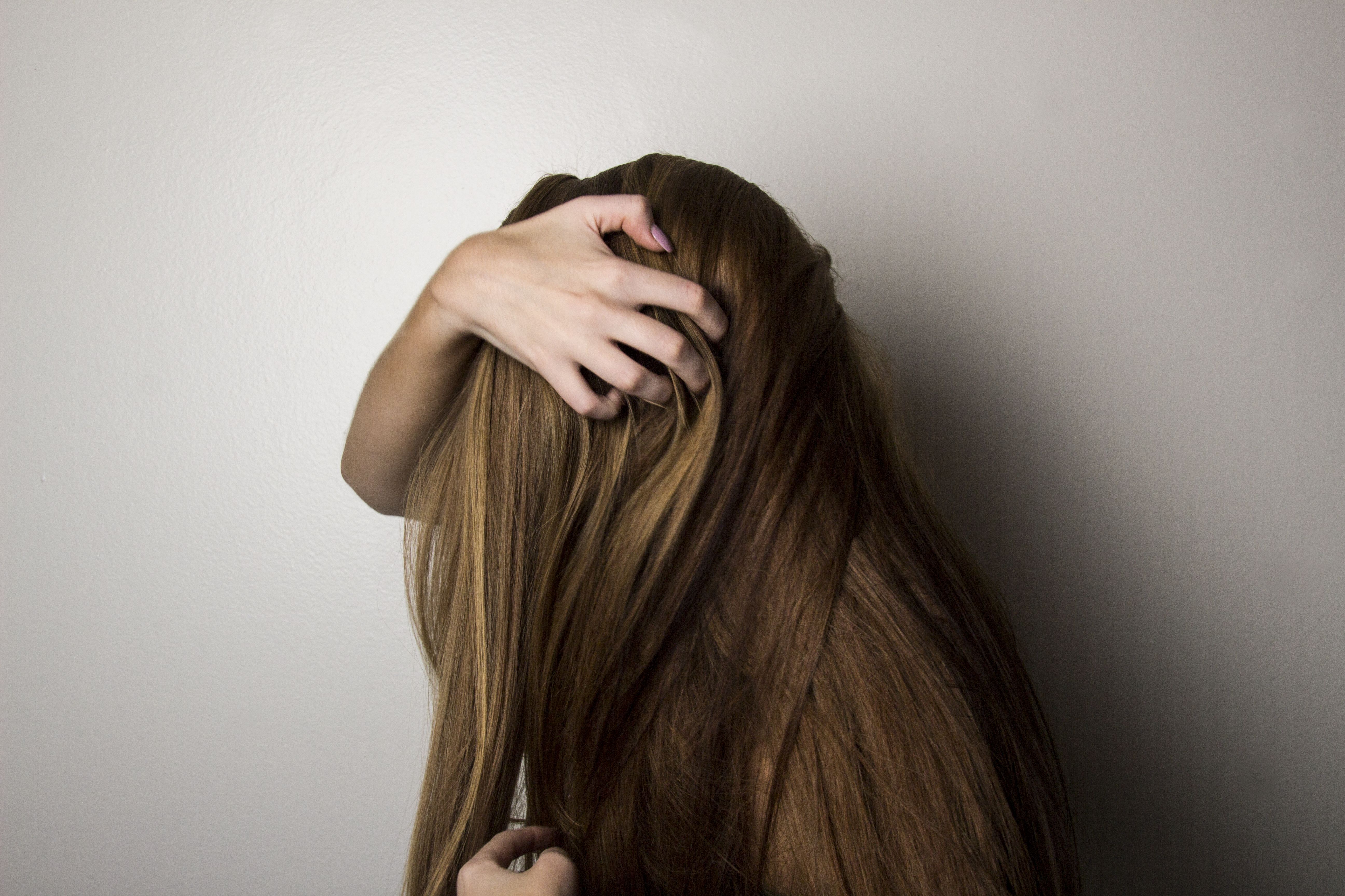 Photo of Woman Covering Face with Her Hair. wallpaper