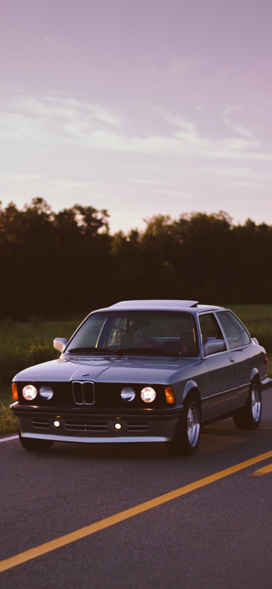 Download 1125x2436 Bmw, Old Cars, Trees, Evening Wallpaper