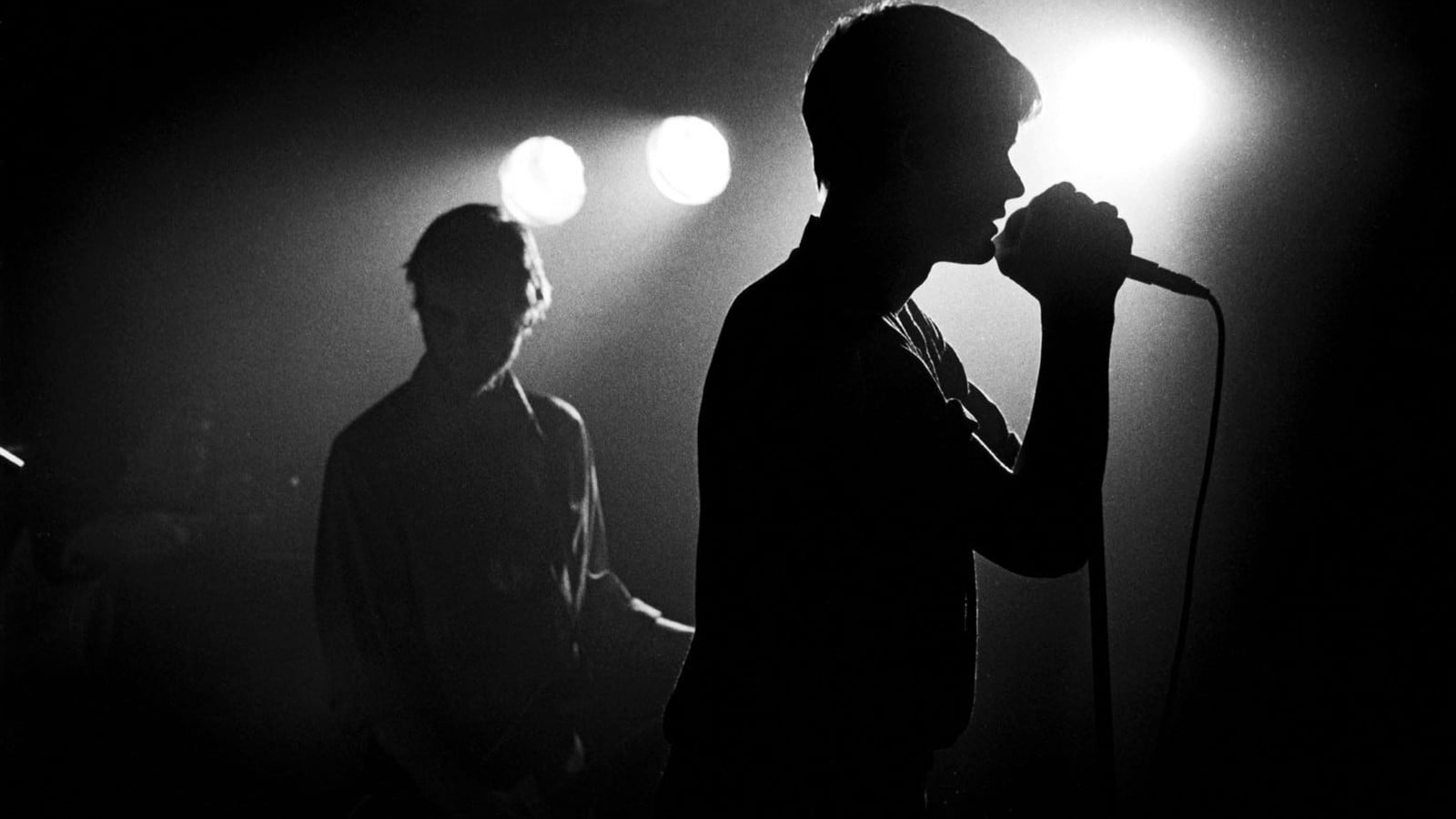 Silhouette of two men, Ian Curtis, Joy Division, music, microphone
