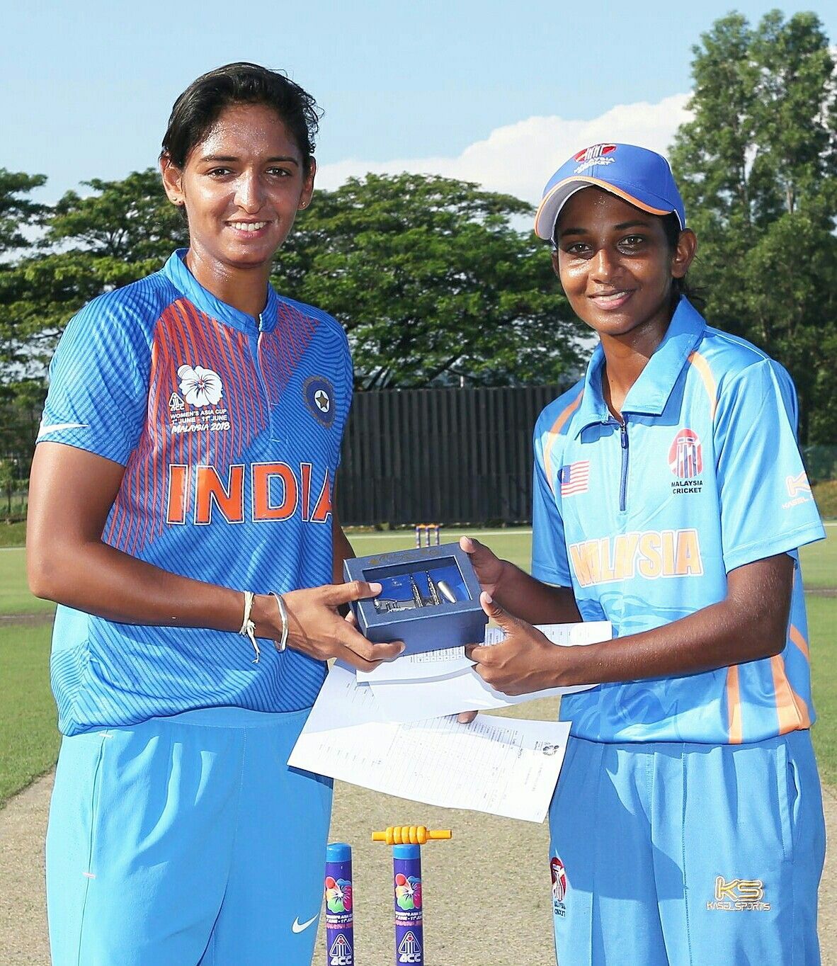 Harmanpreet Kaur with Malaysian Captain in a match between India