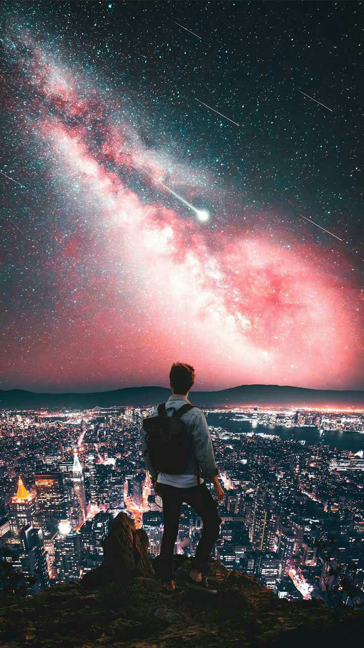 Man on Mountain City Night Galaxy View Stars Wallpaper