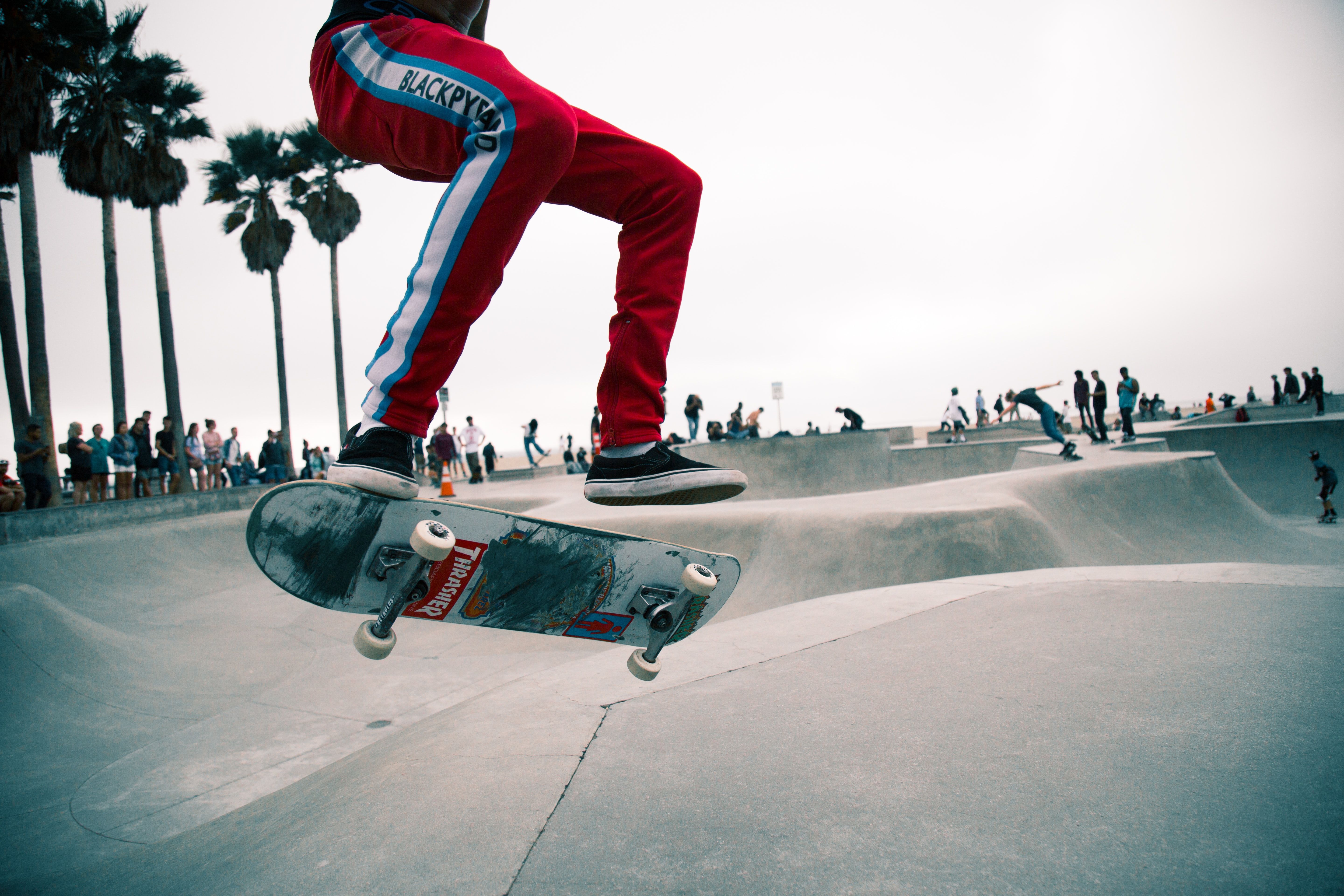 person doing skateboarding tricks photo