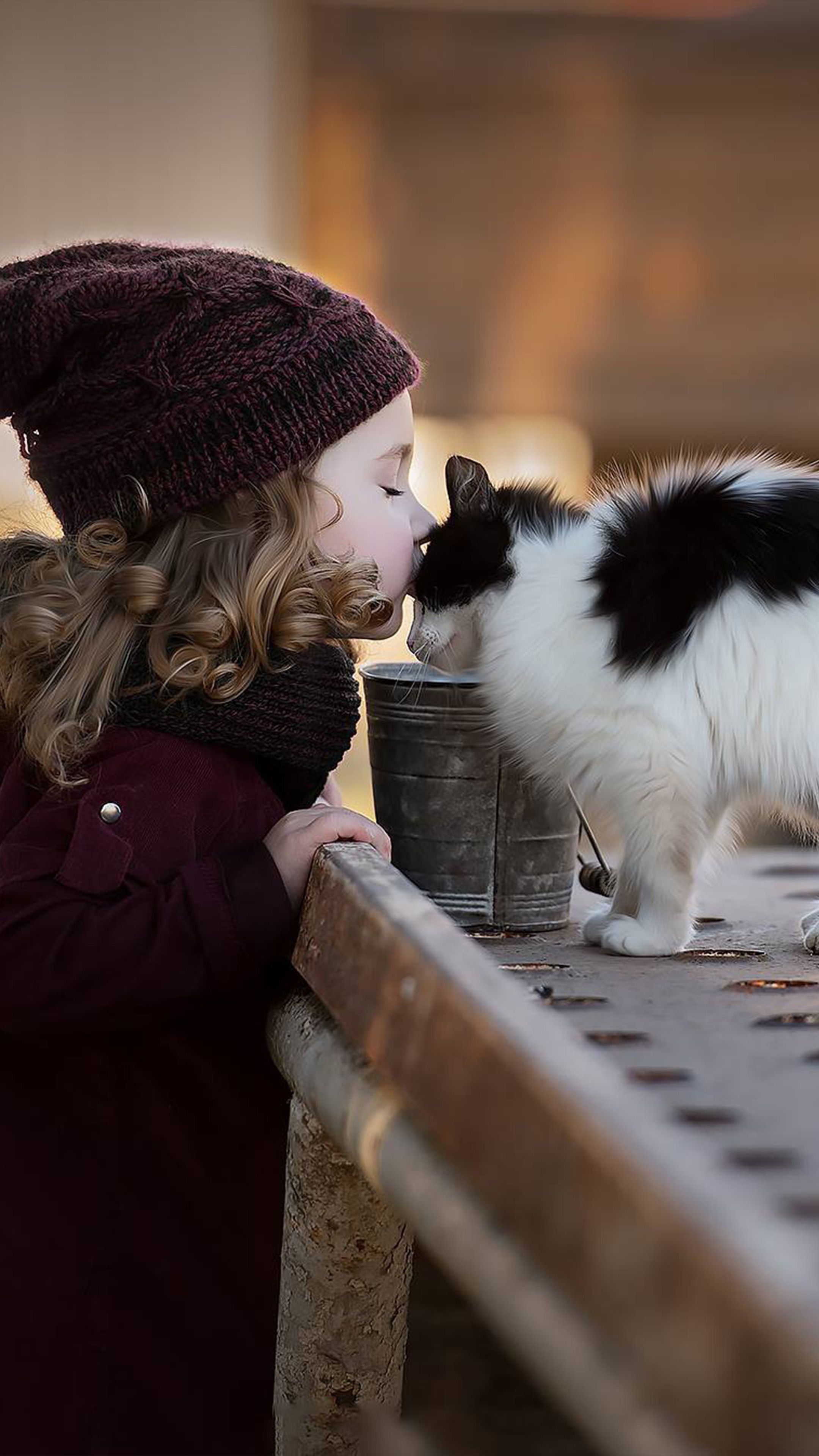 Adorable Girl Child Kissing Cat Free 4K Ultra HD Mobile Wallpaper