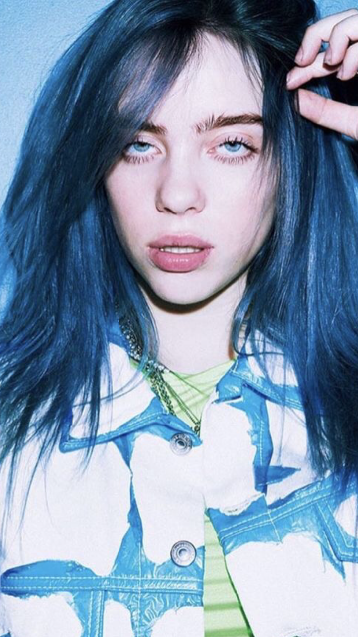 Billie eilish smiling blue hair. 