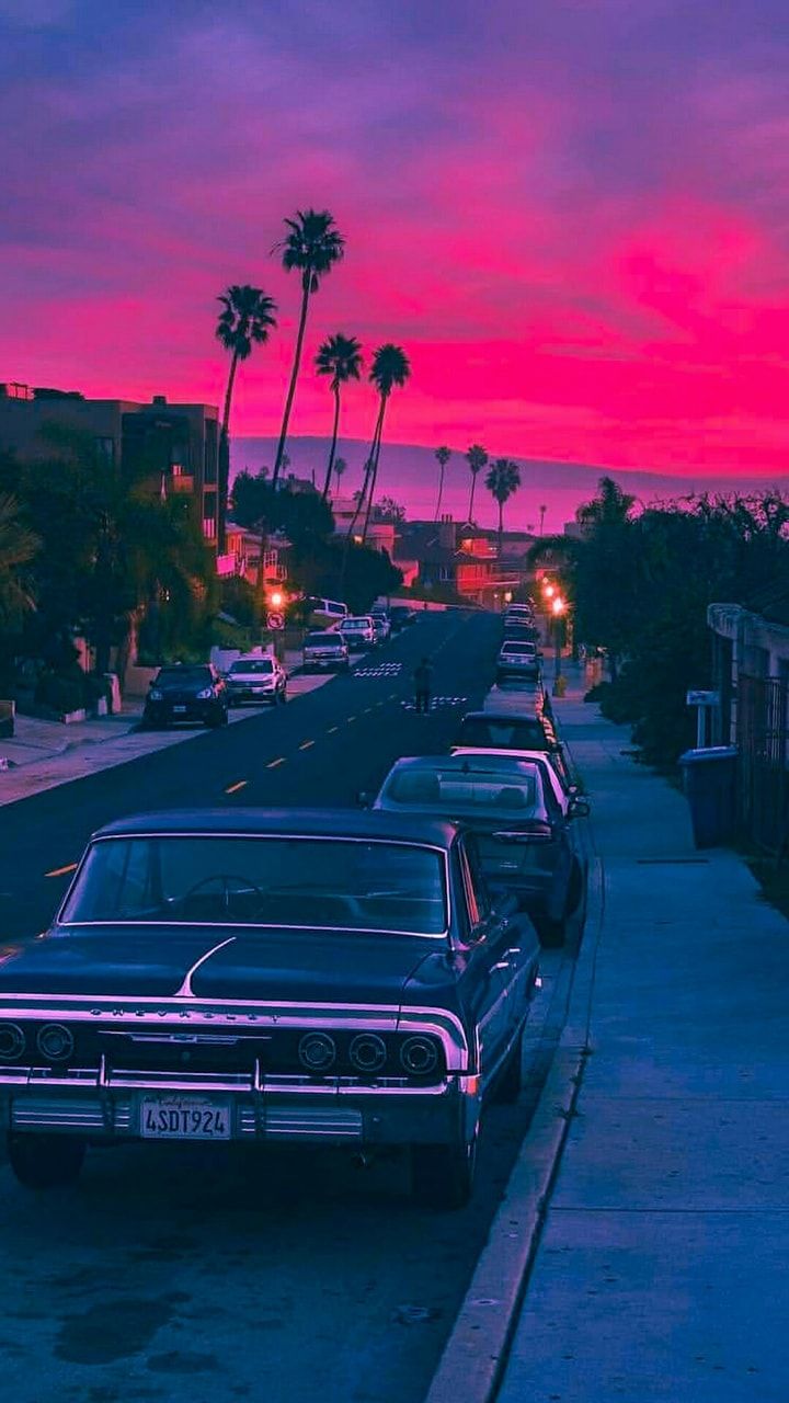 Vintage car parked on Ocean Blvd during sunset iPhone 12 Wallpapers Free  Download