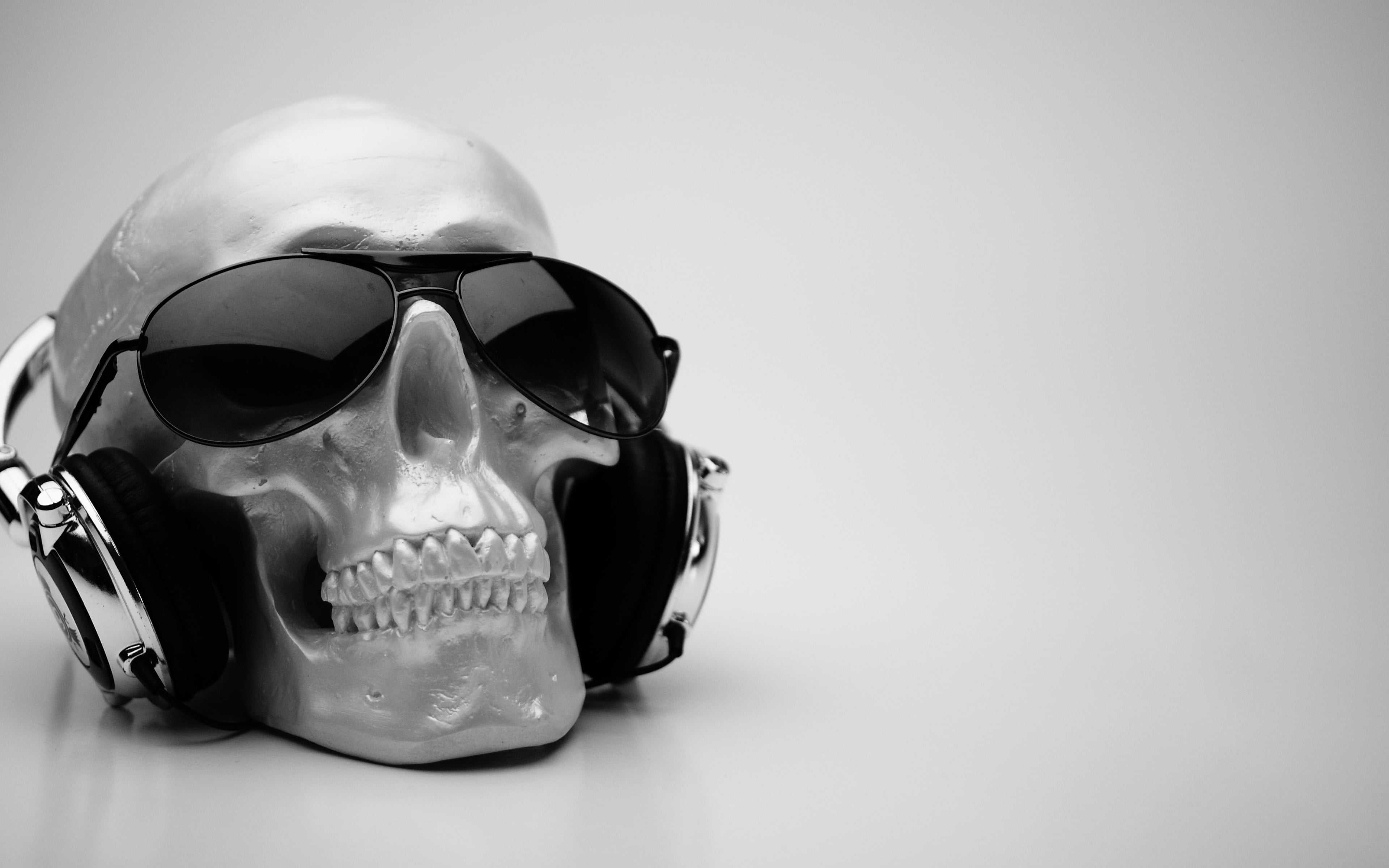 Black framed aviator sunglasses, headphones, skull, sunglasses
