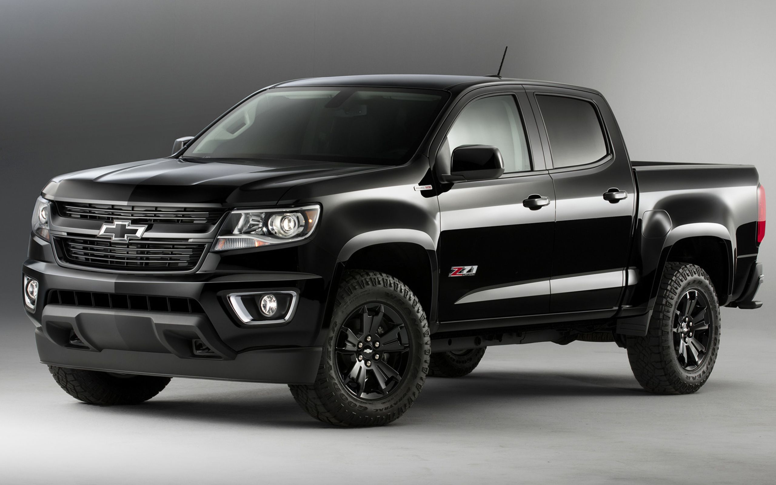 Black car pickup Chevrolet Colorado on a gray background Desktop