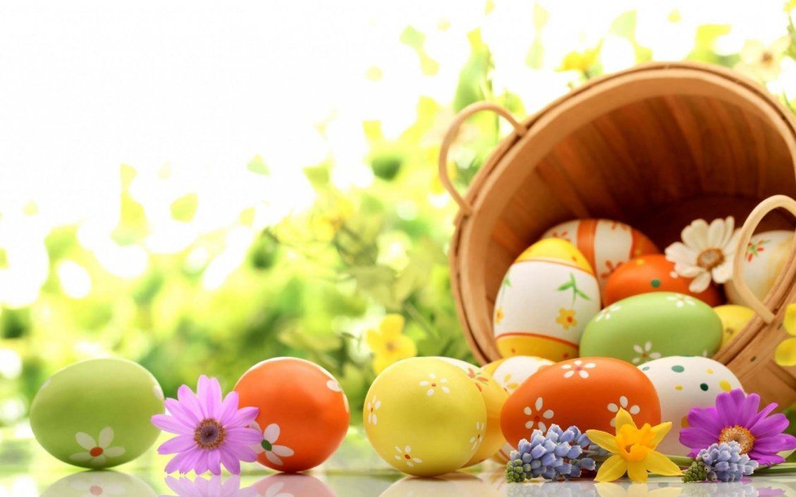 Wooden basket full with Easter eggs
