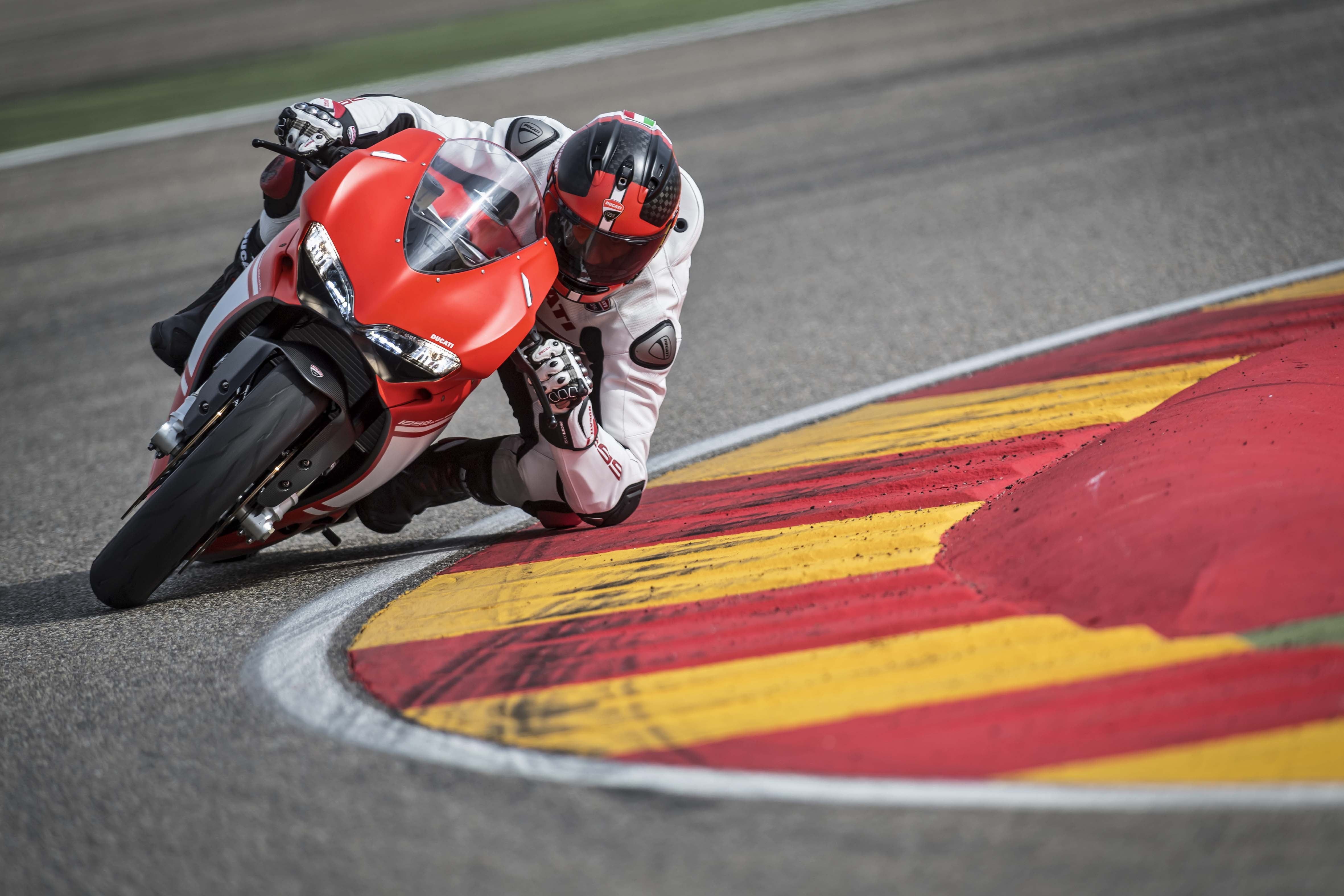 Red and white sport bike on racing track HD wallpaper. Wallpaper
