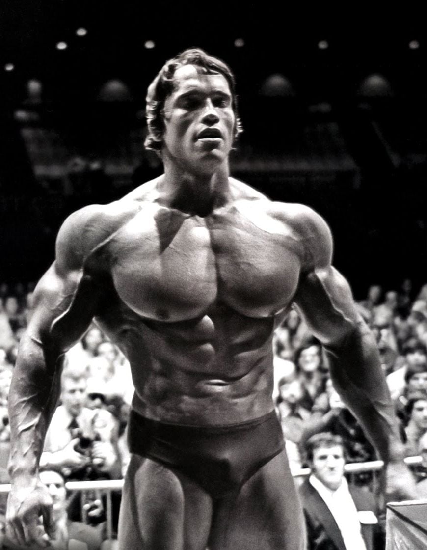 Arnold Schwarzenegger Posing On Stage Schwarzenegger