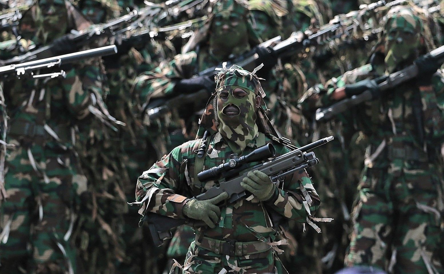 Sri Lankan army soldiers march during a Victory Day parade
