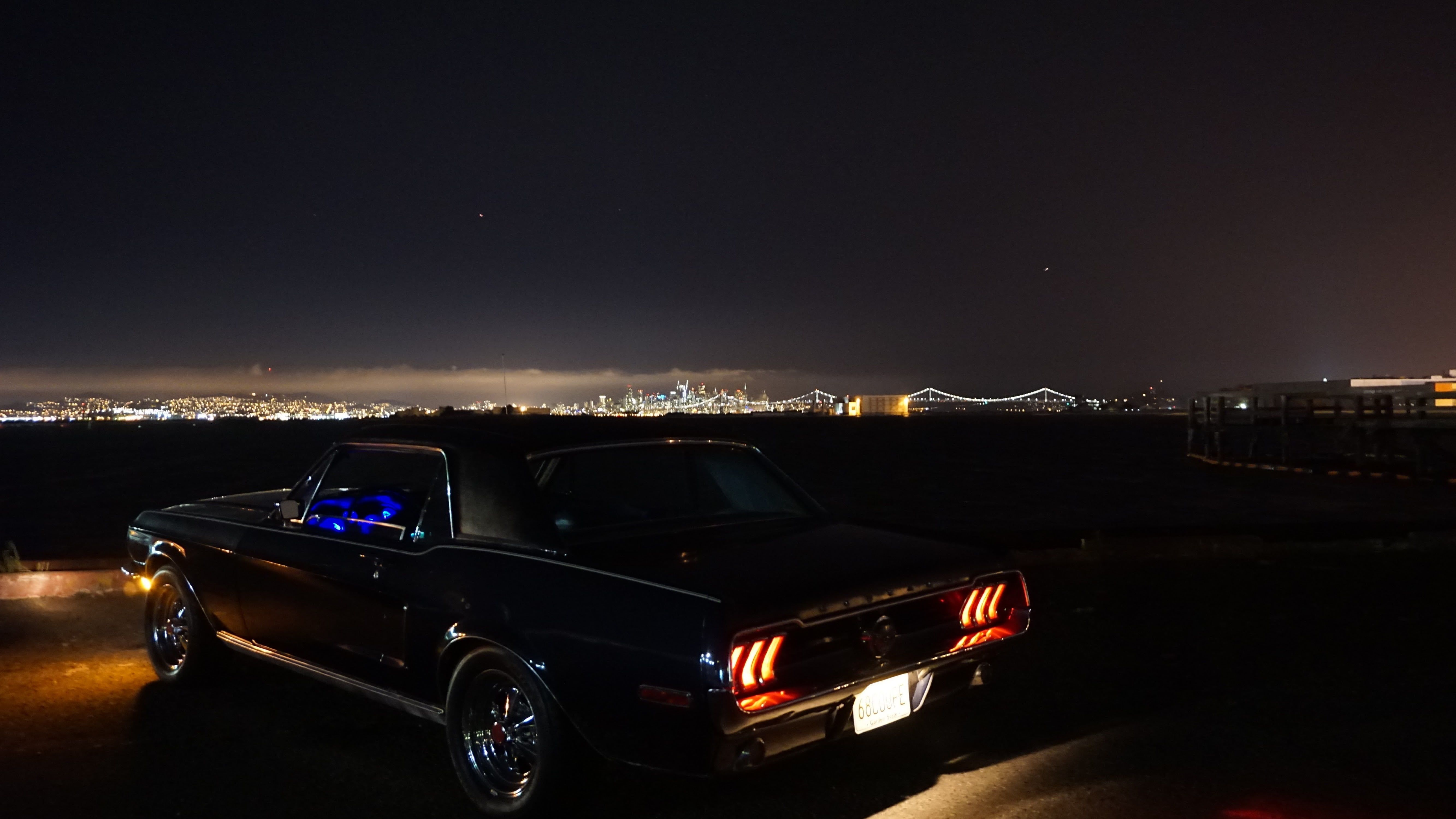 Black classic Ford Mustang at night HD wallpaper