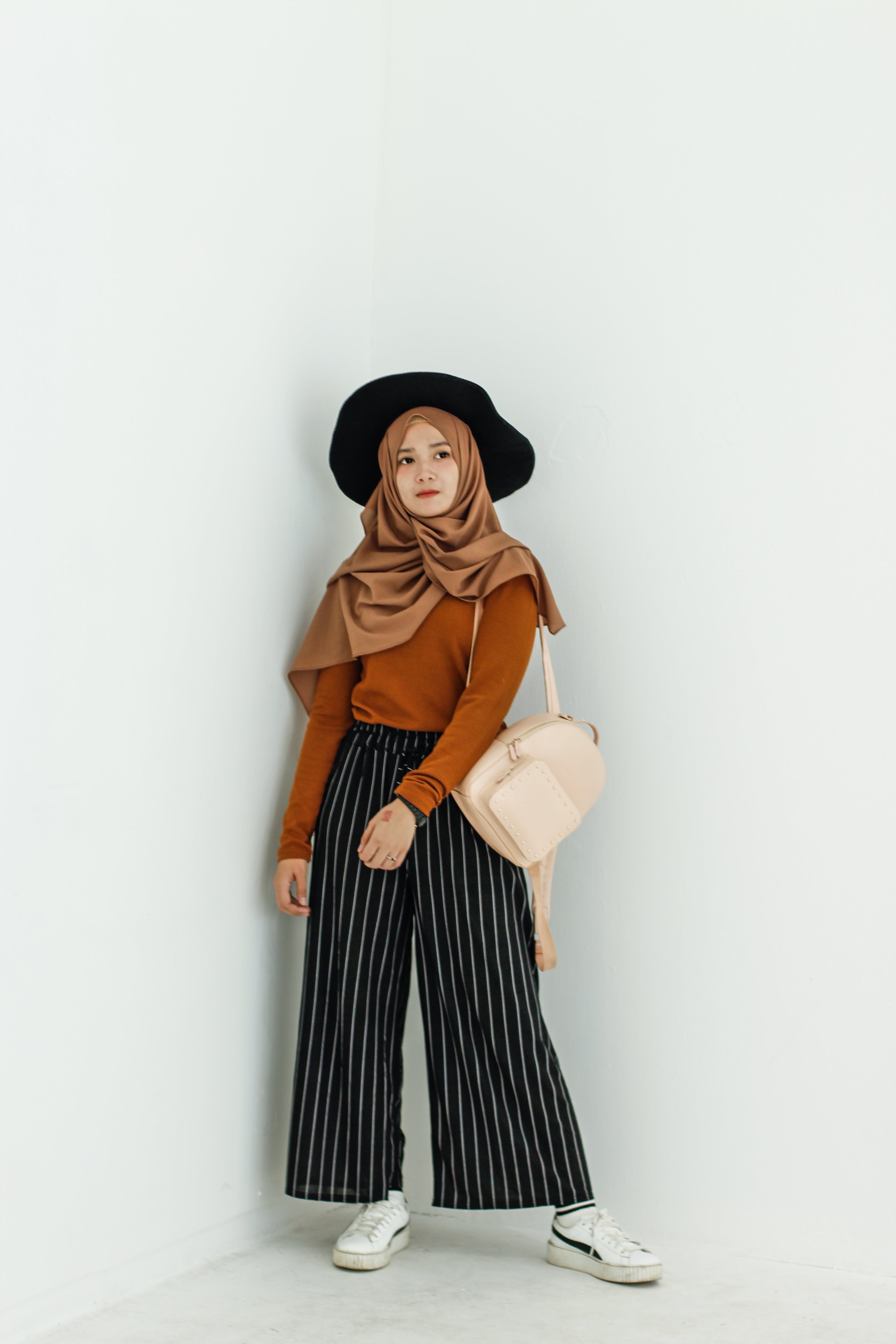 Woman In Brown Long Sleeved Shirt And Brown Hijab Headdress