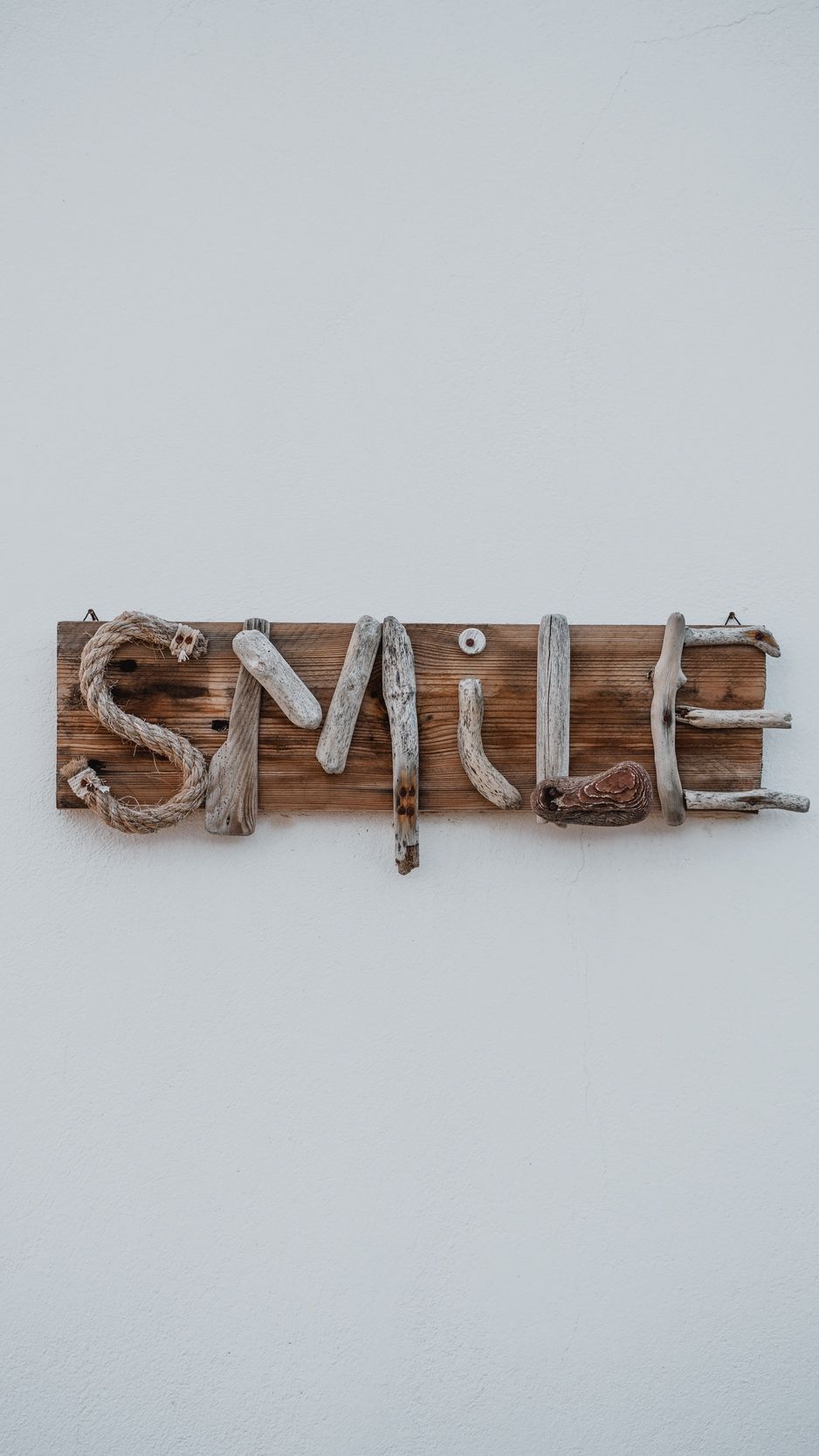 Download wallpaper 938x1668 smile, inscription, wooden, creative