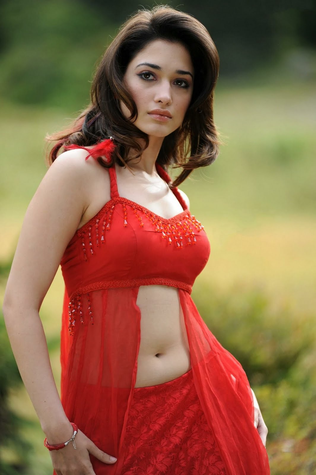 Download Tamanna Hot Navel show in Red Dress from Oosaravelli.