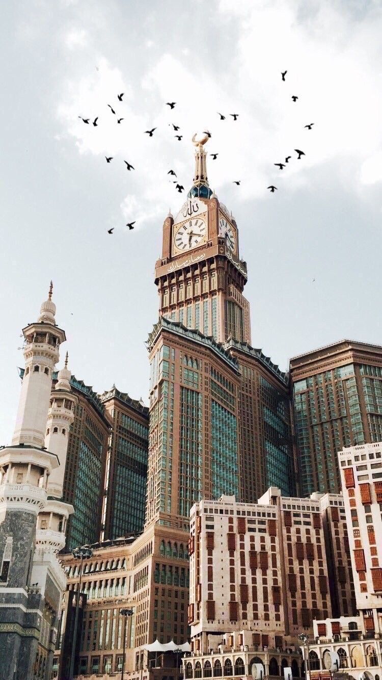 The Kaabah and Fluffy Clouds · Creative Fabrica
