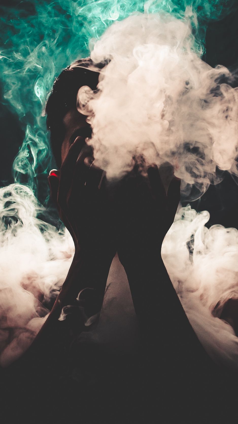 Download wallpaper 938x1668 man, smoke, hands, colorful smoke