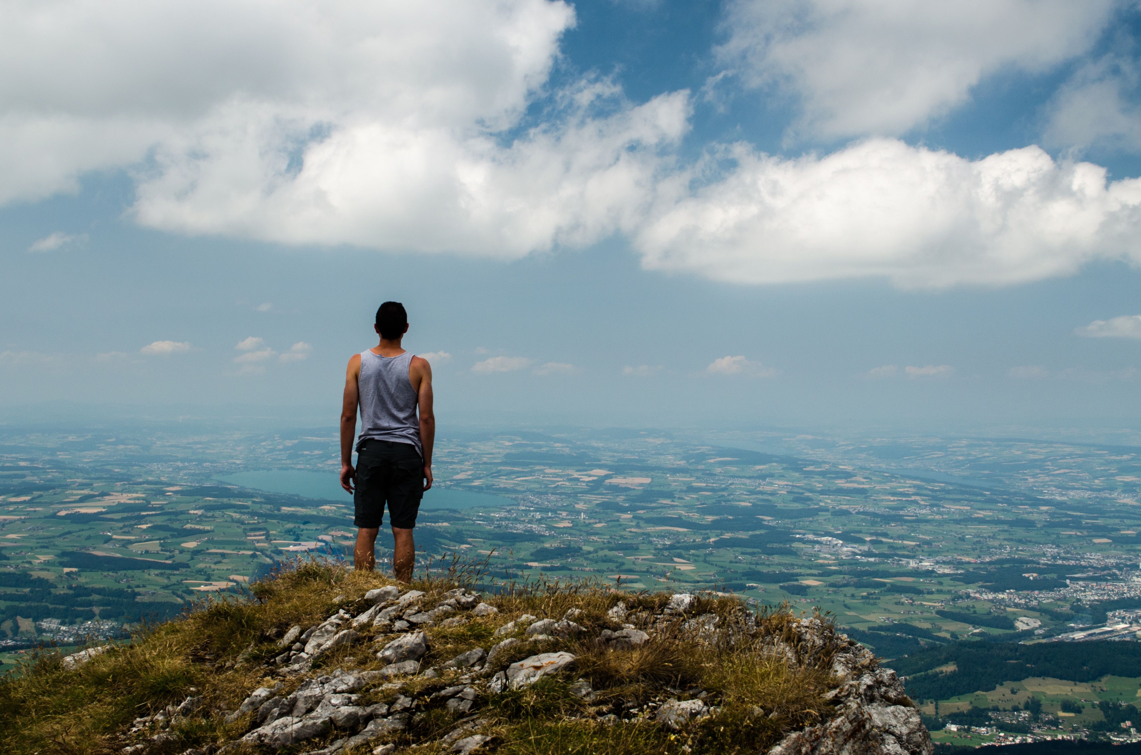 man standing at mountain top free image