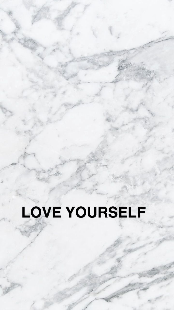 Marble background with quote 'love yourself'