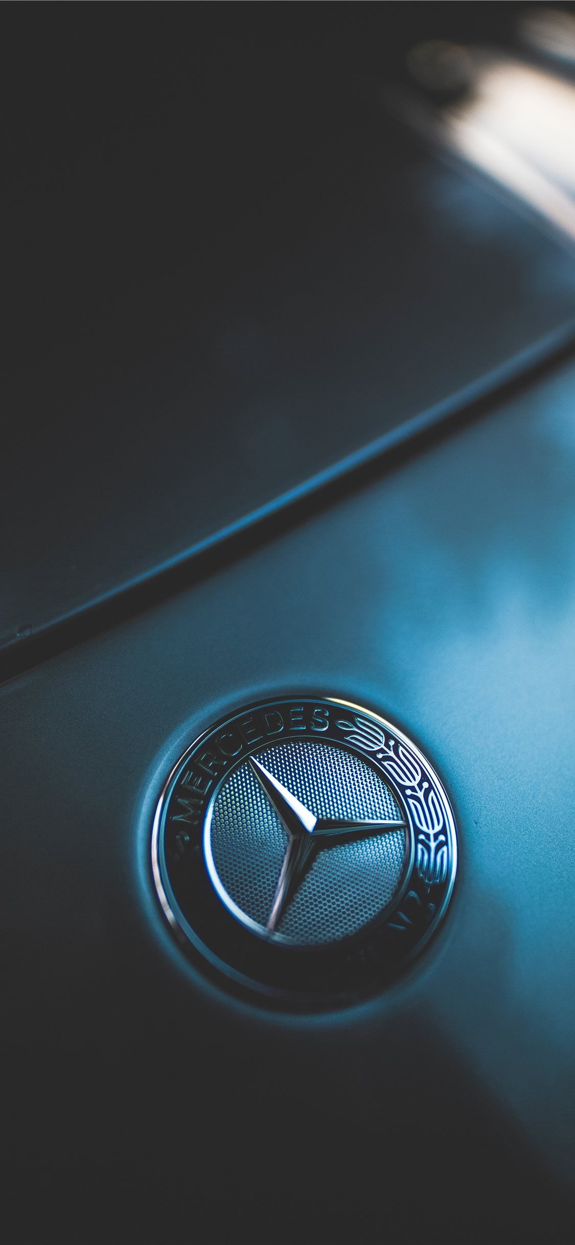 closeup photo of Mercedes Benz emblem iPhone X Wallpaper Free