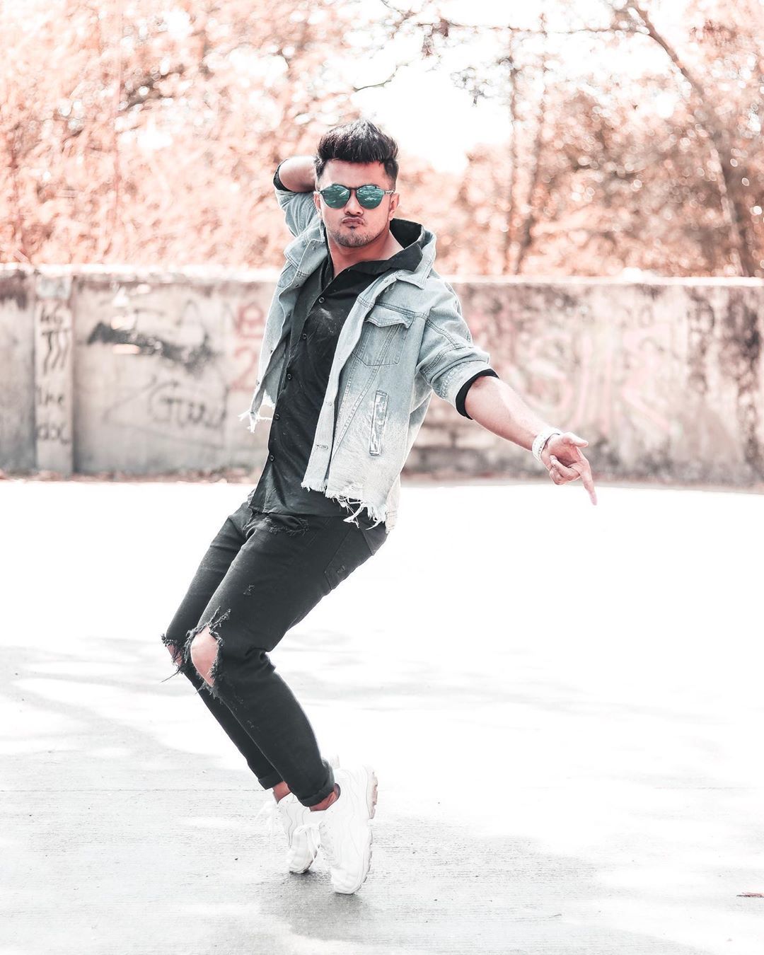 Image may contain: 1 person, standing, shoes and outdoor. Fashion