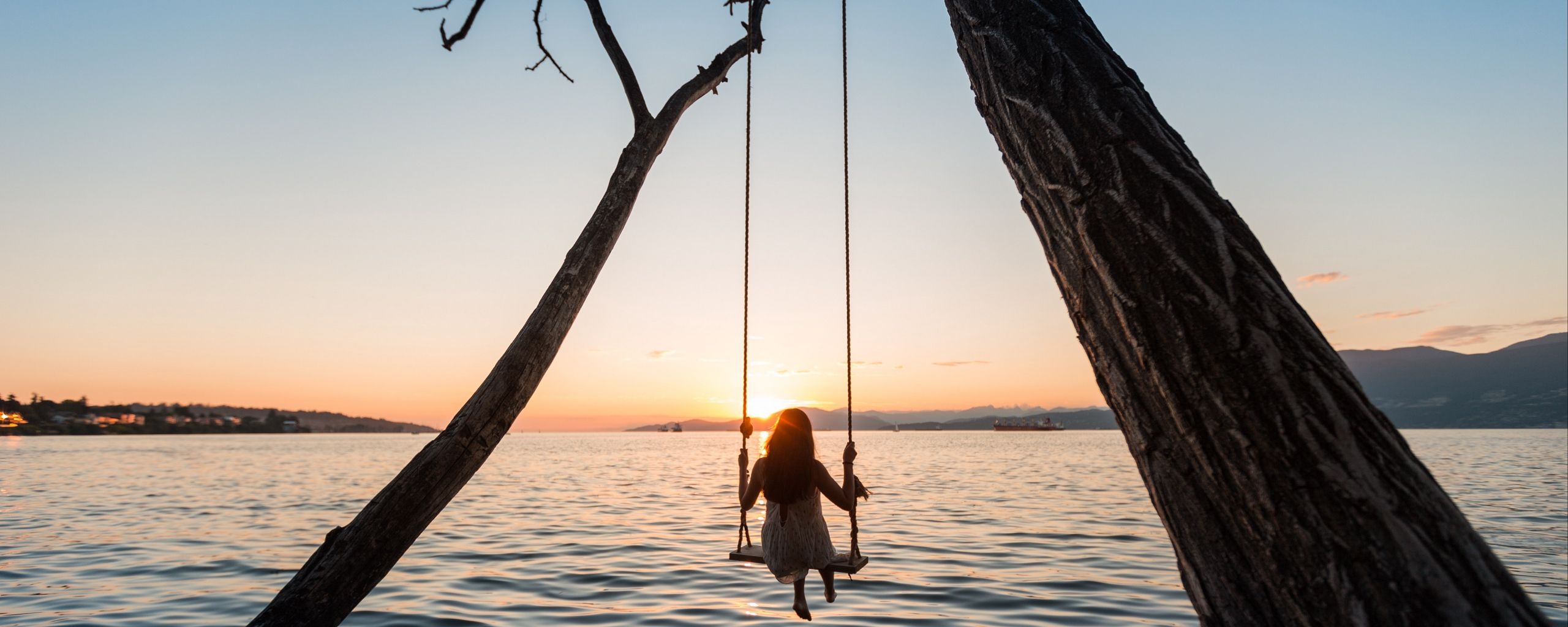 Download wallpaper 2560x1024 swing, girl, sunset, lake, river