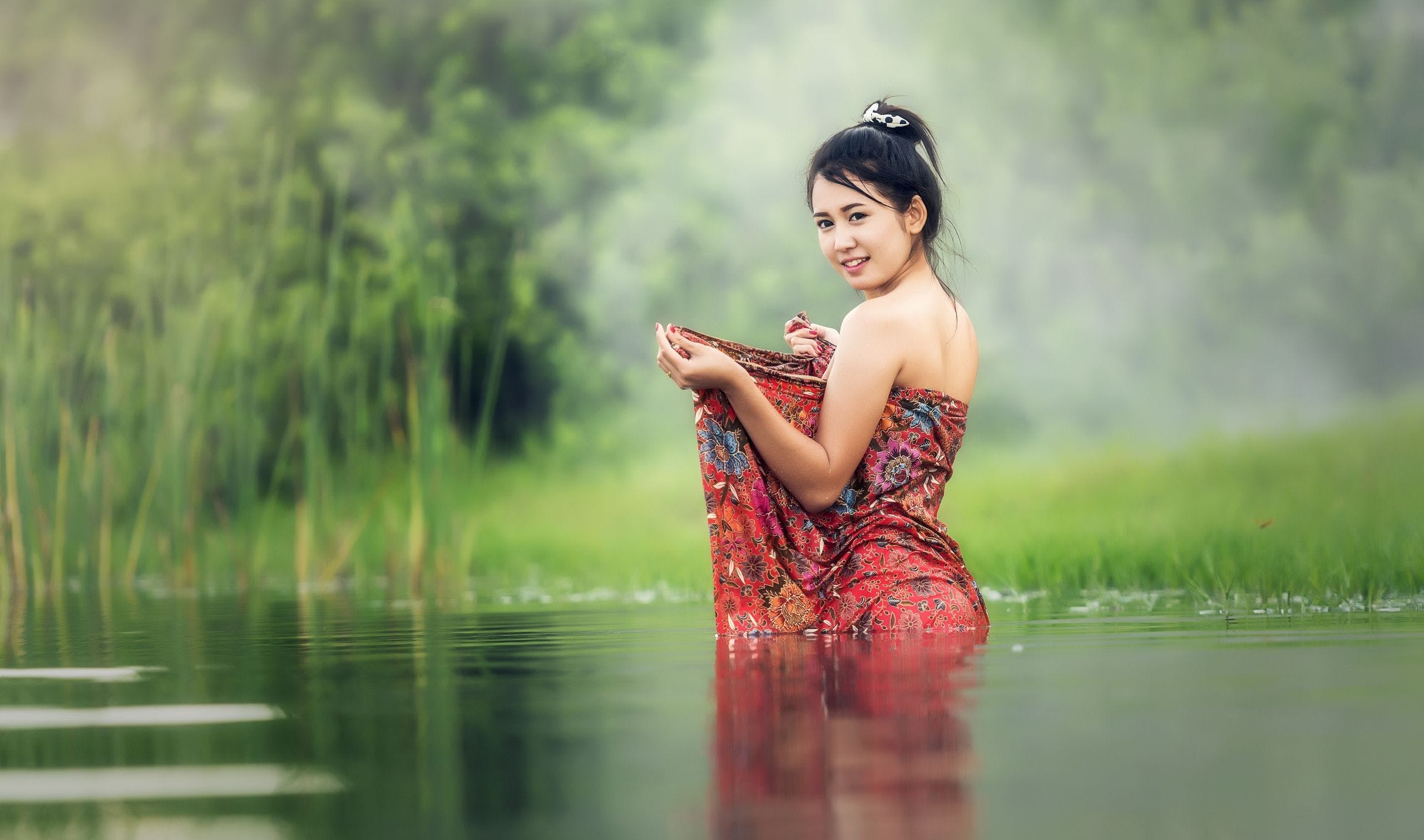 HD Asian Woman Washing River Wallpaper