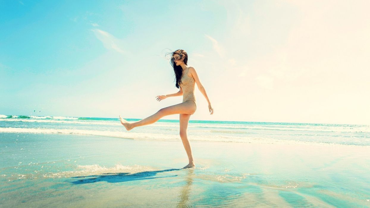Sensuality sensual woman girl model beach sunlight legs sea