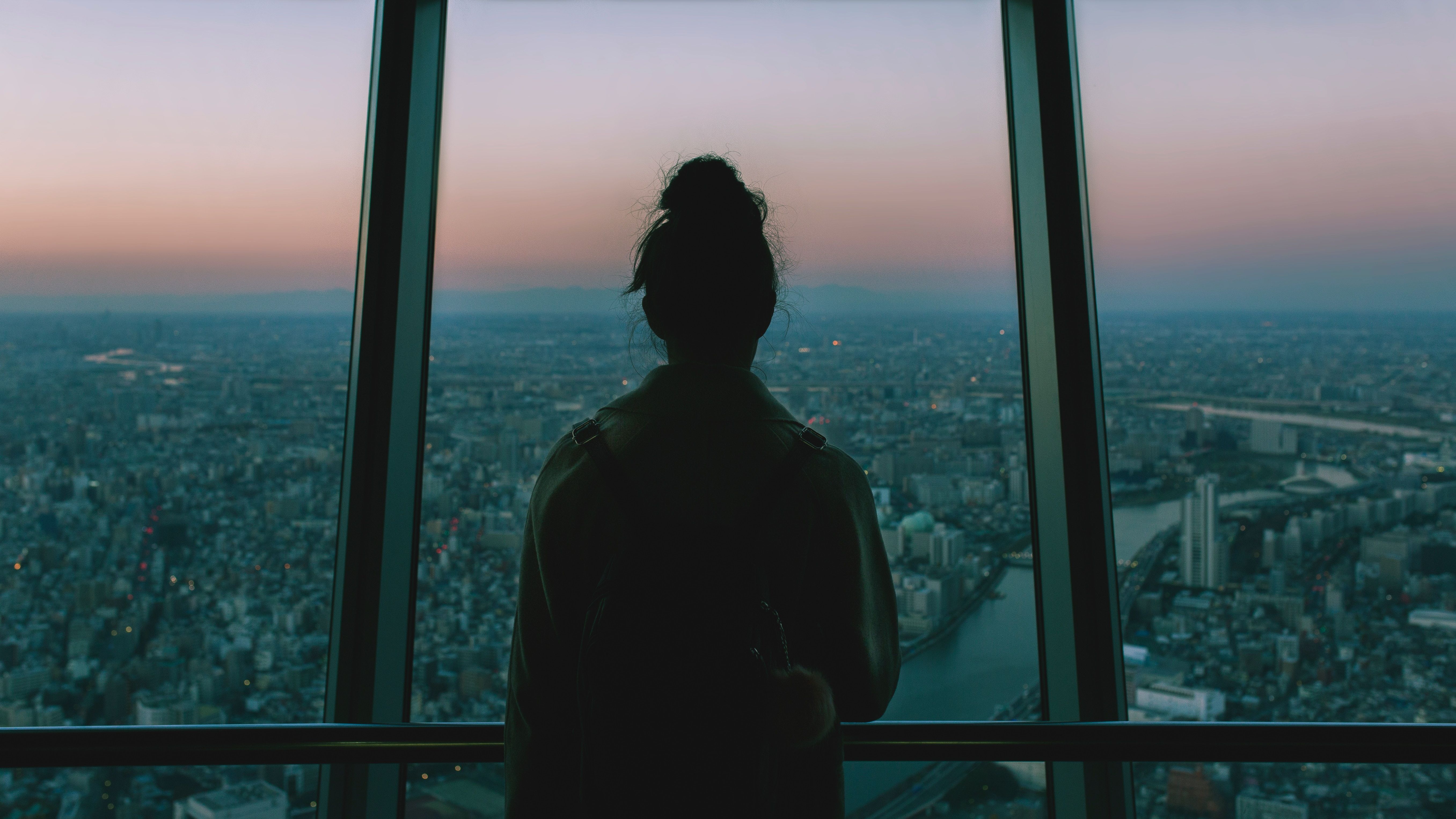 girl looking over city wallpaper and background