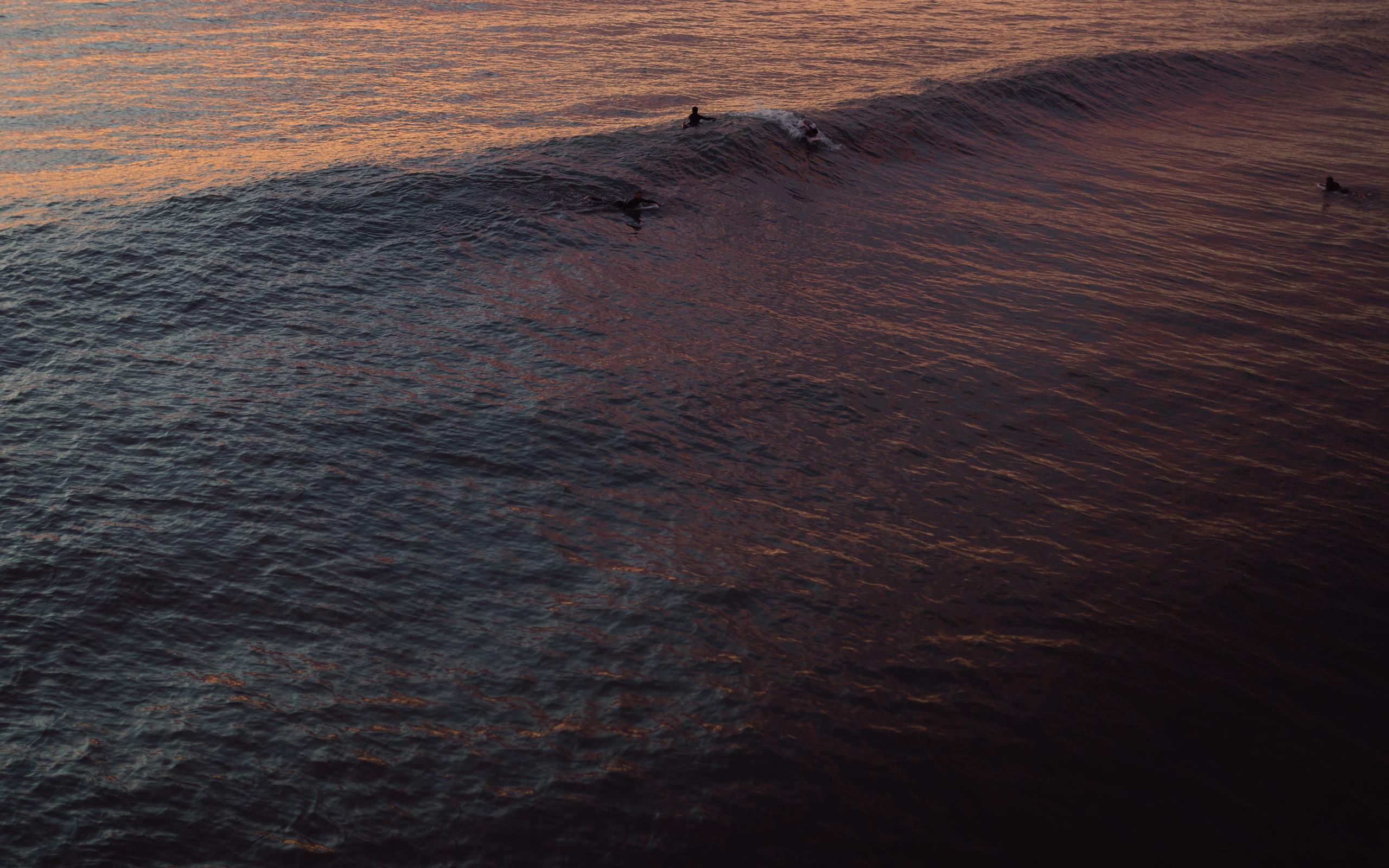 few people on body of water iMac Wallpaper Download