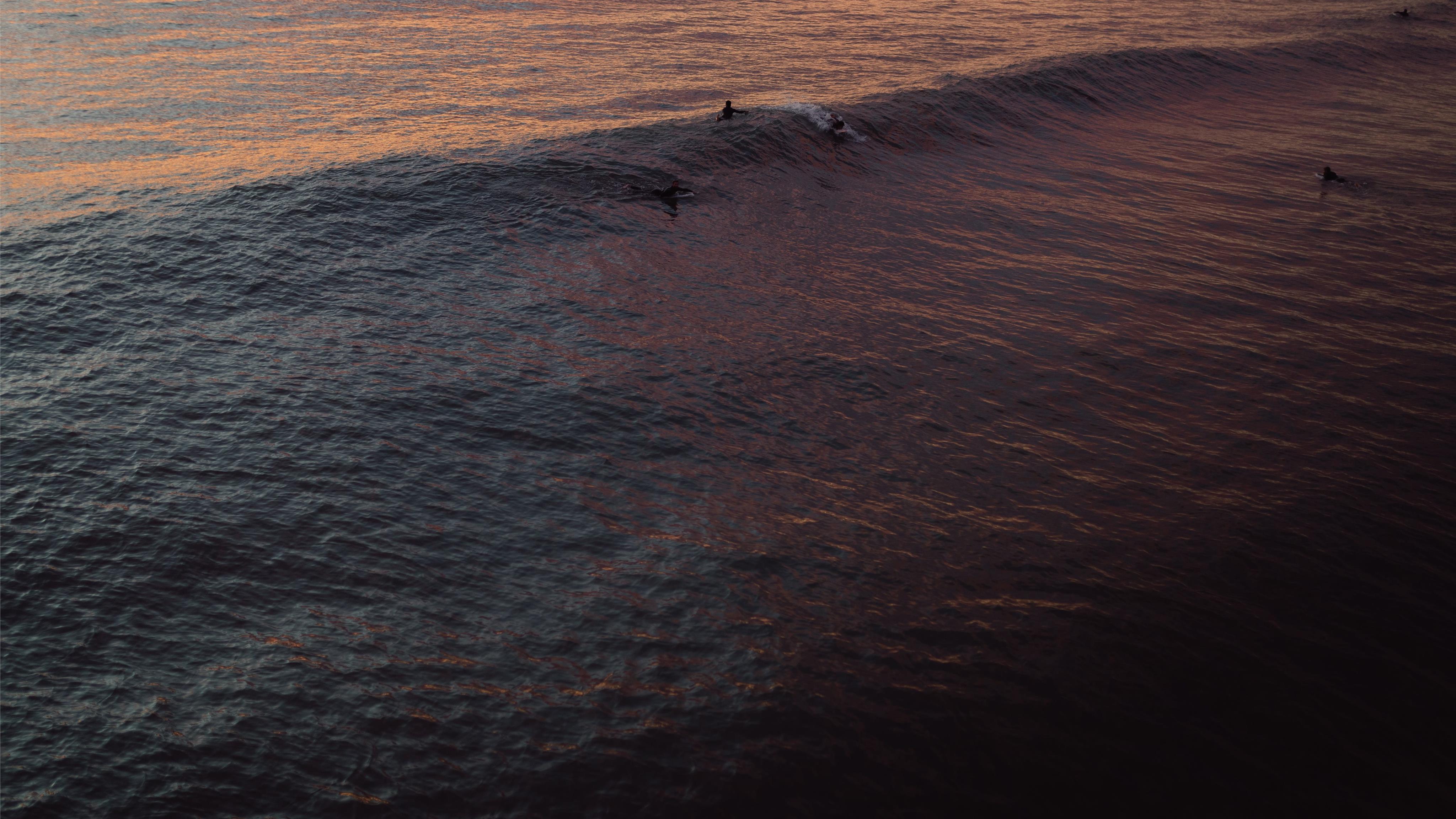 few people on body of water iMac Wallpaper Download