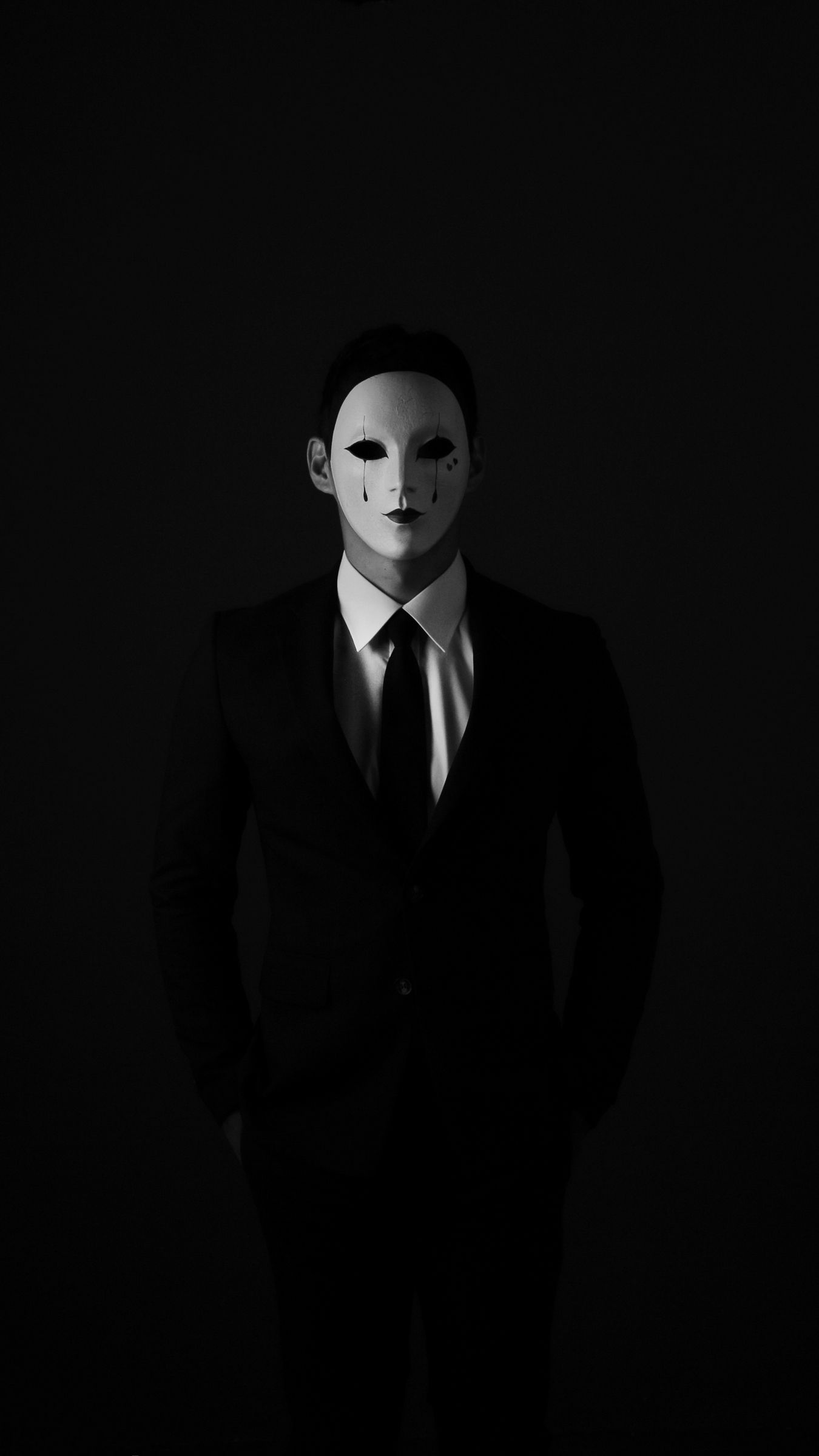 Download wallpaper 1350x2400 mask, anonymous, bw, tie, suit jacket