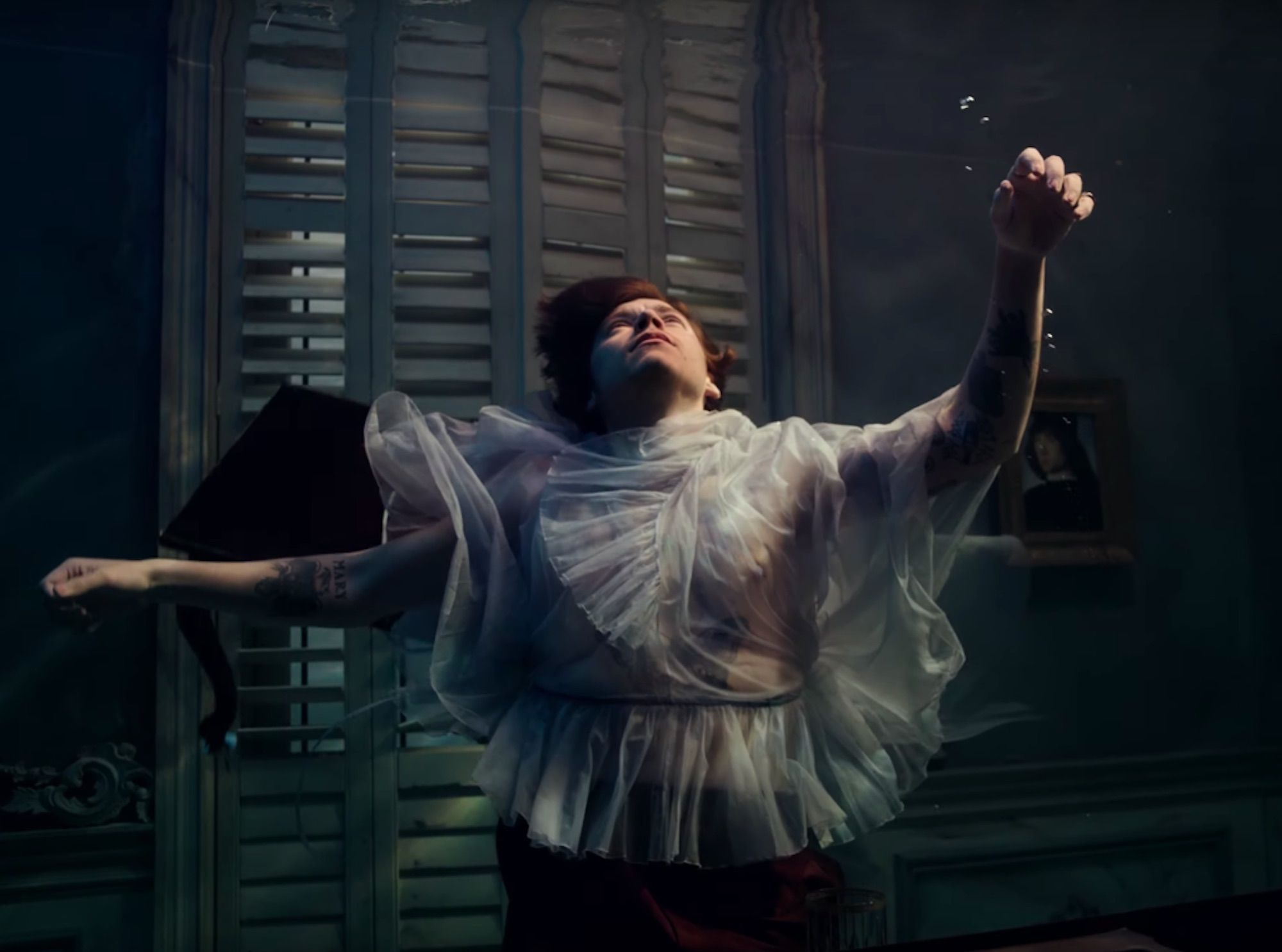Harry Styles drowns in sheer tulle in the music video for Falling